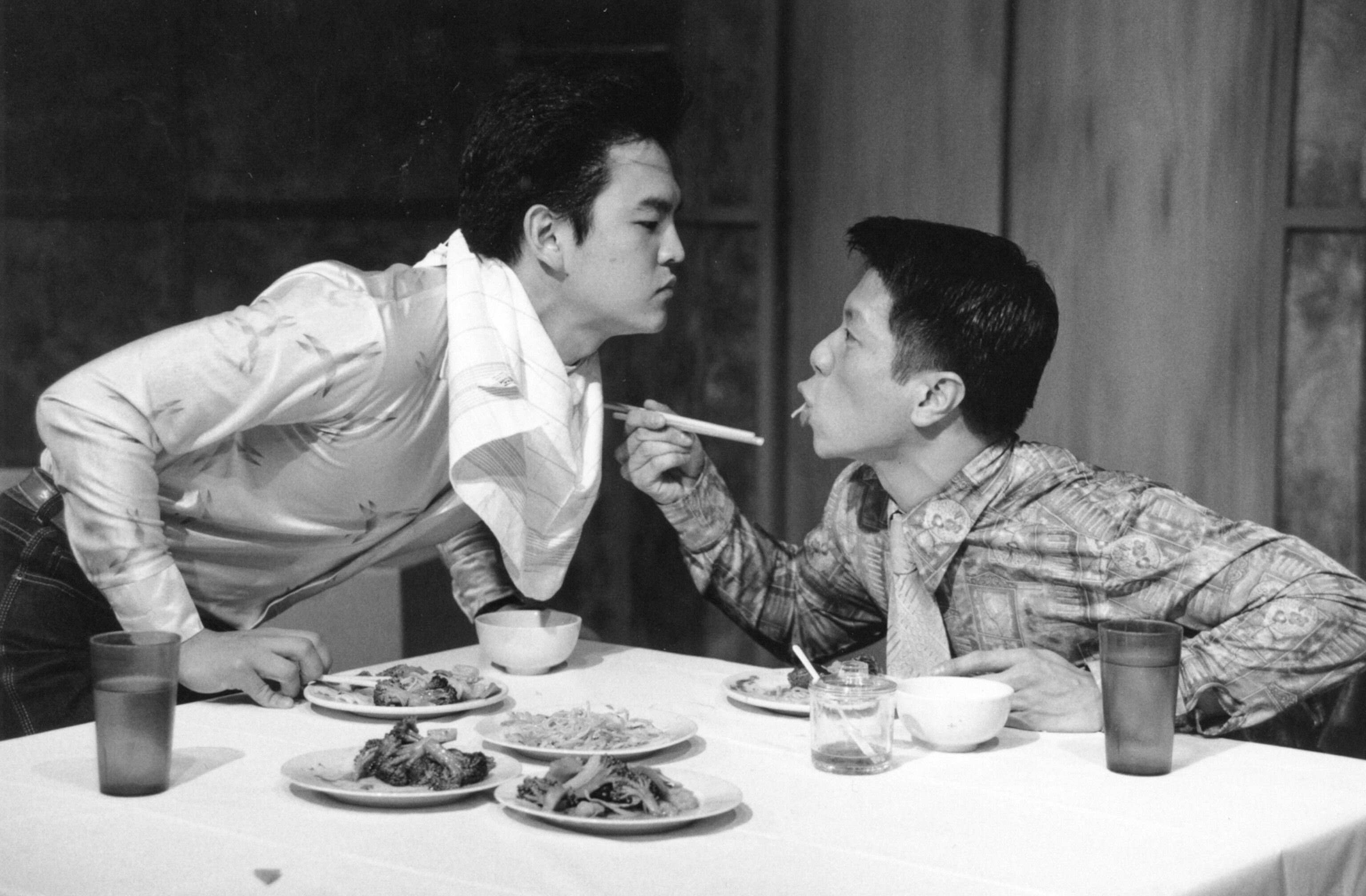 two actors look each other in the eye