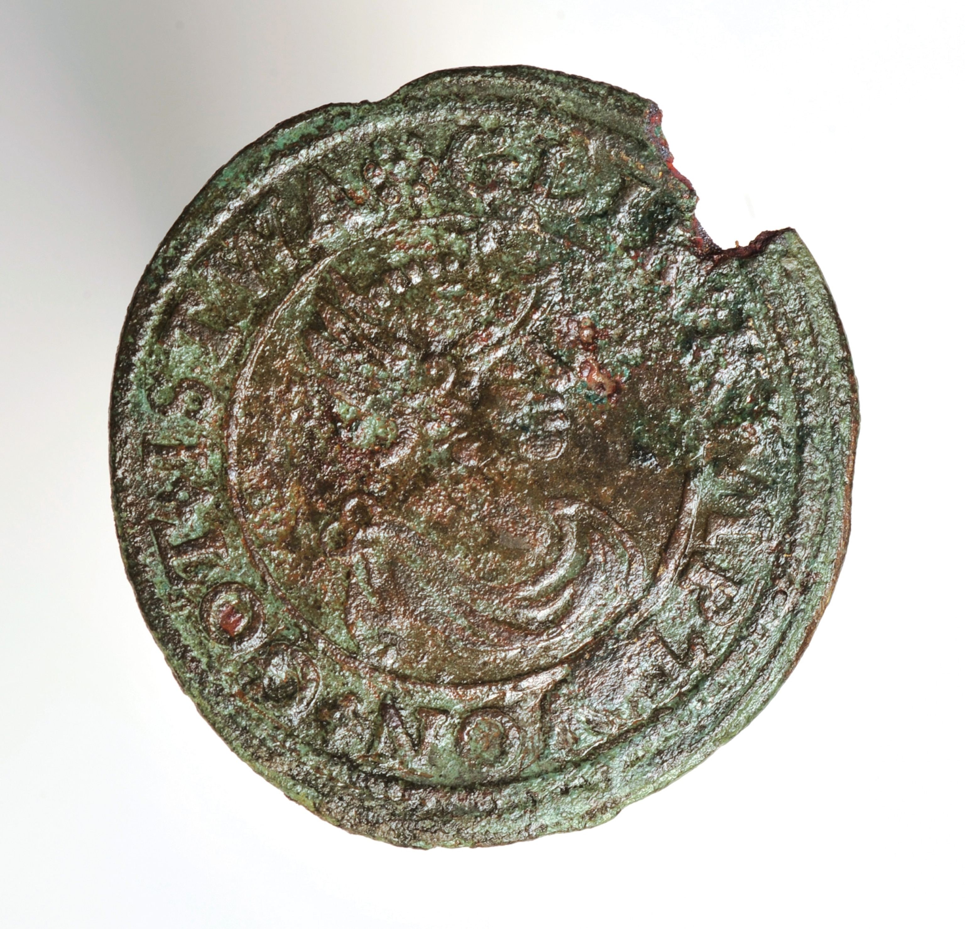 A trade token, small change used to buy retail goods, dug up in the palace