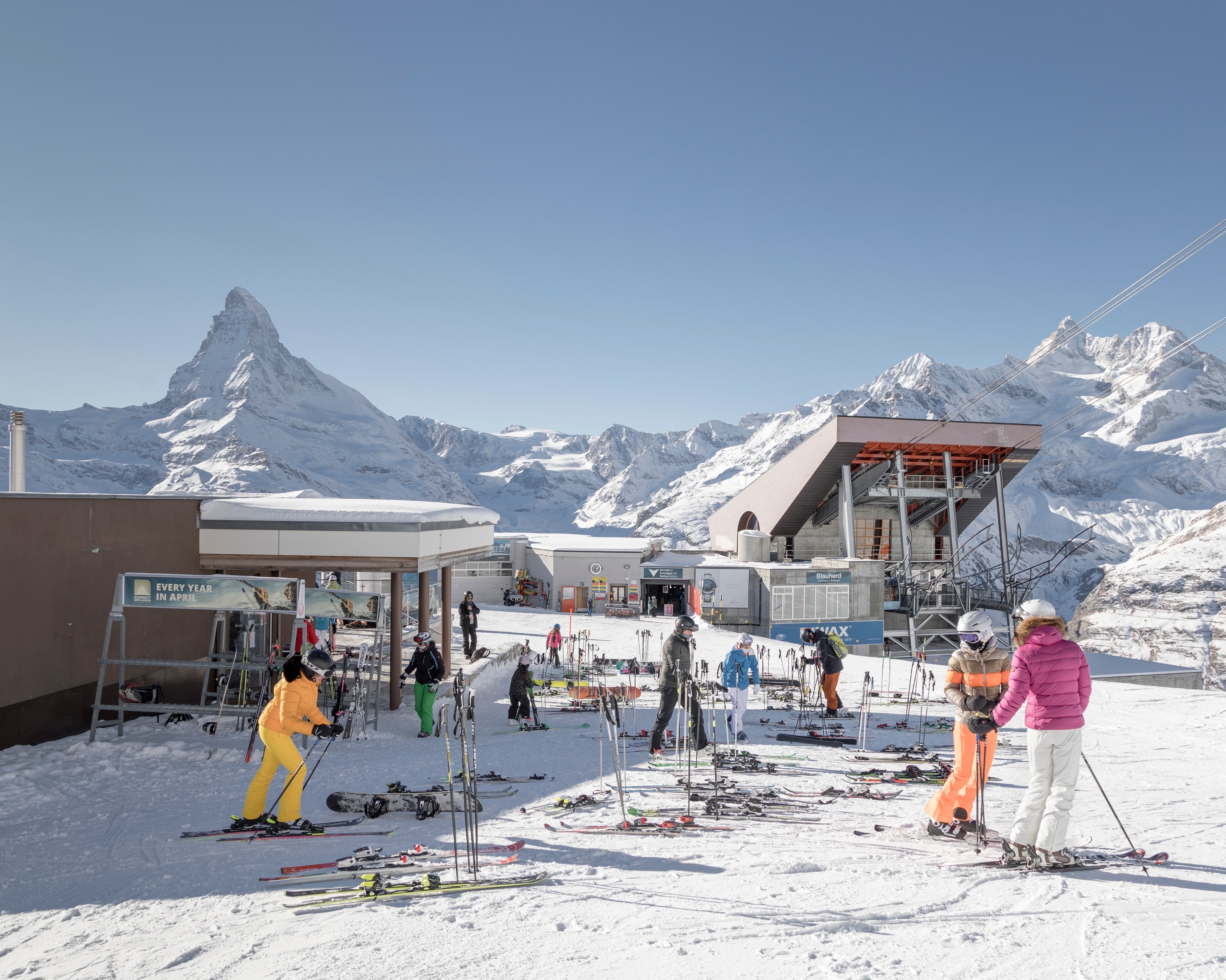 tourists outside a restaurant in Zermatt ski resort