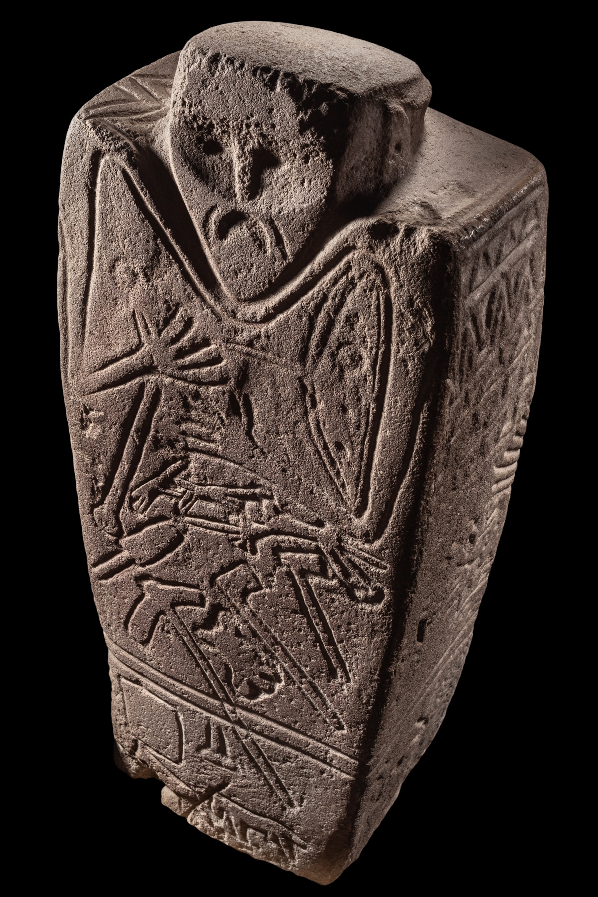 stone statue features several axes and horses.