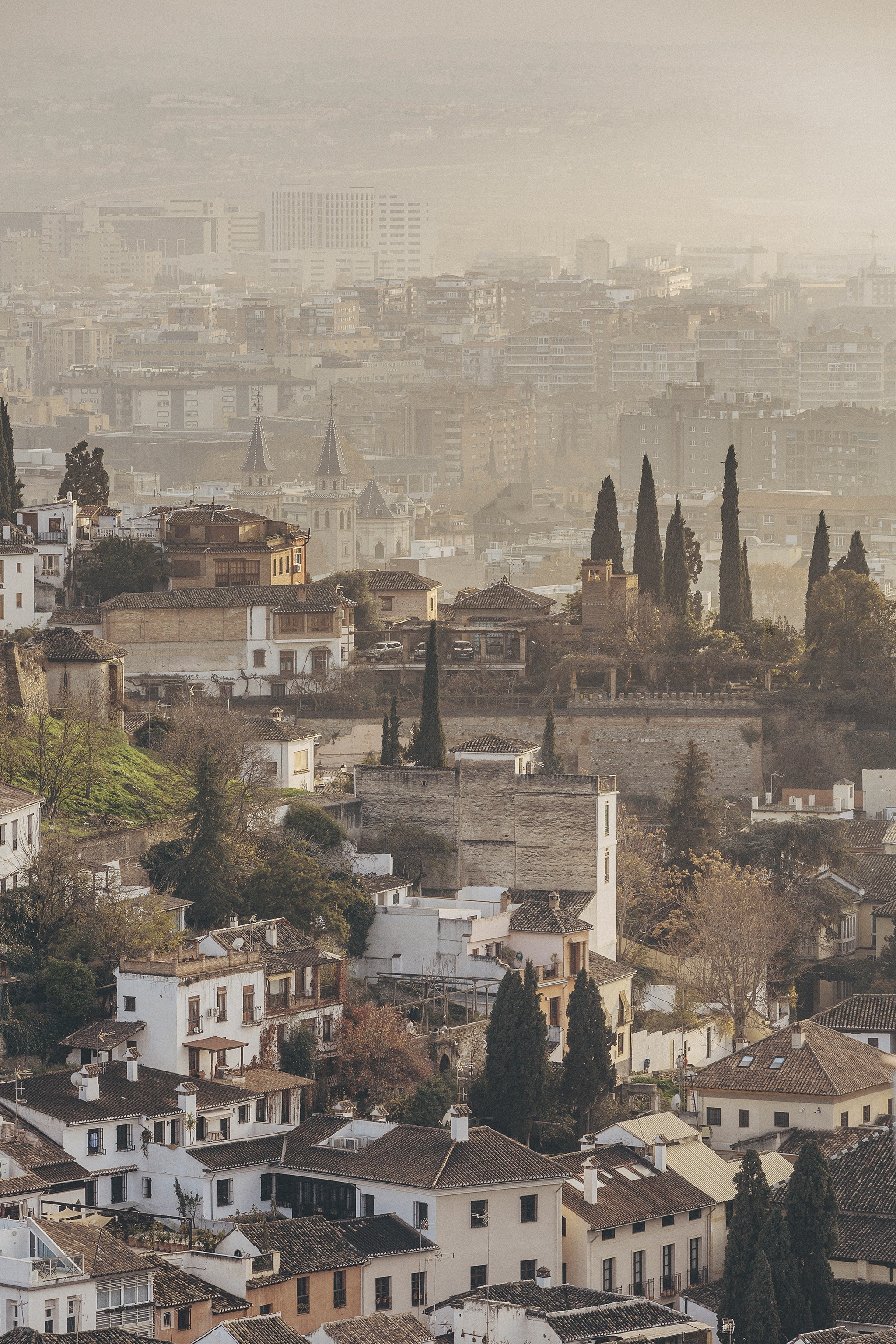 A distant overview of the city and its facades from the Mirador de San Nicolas