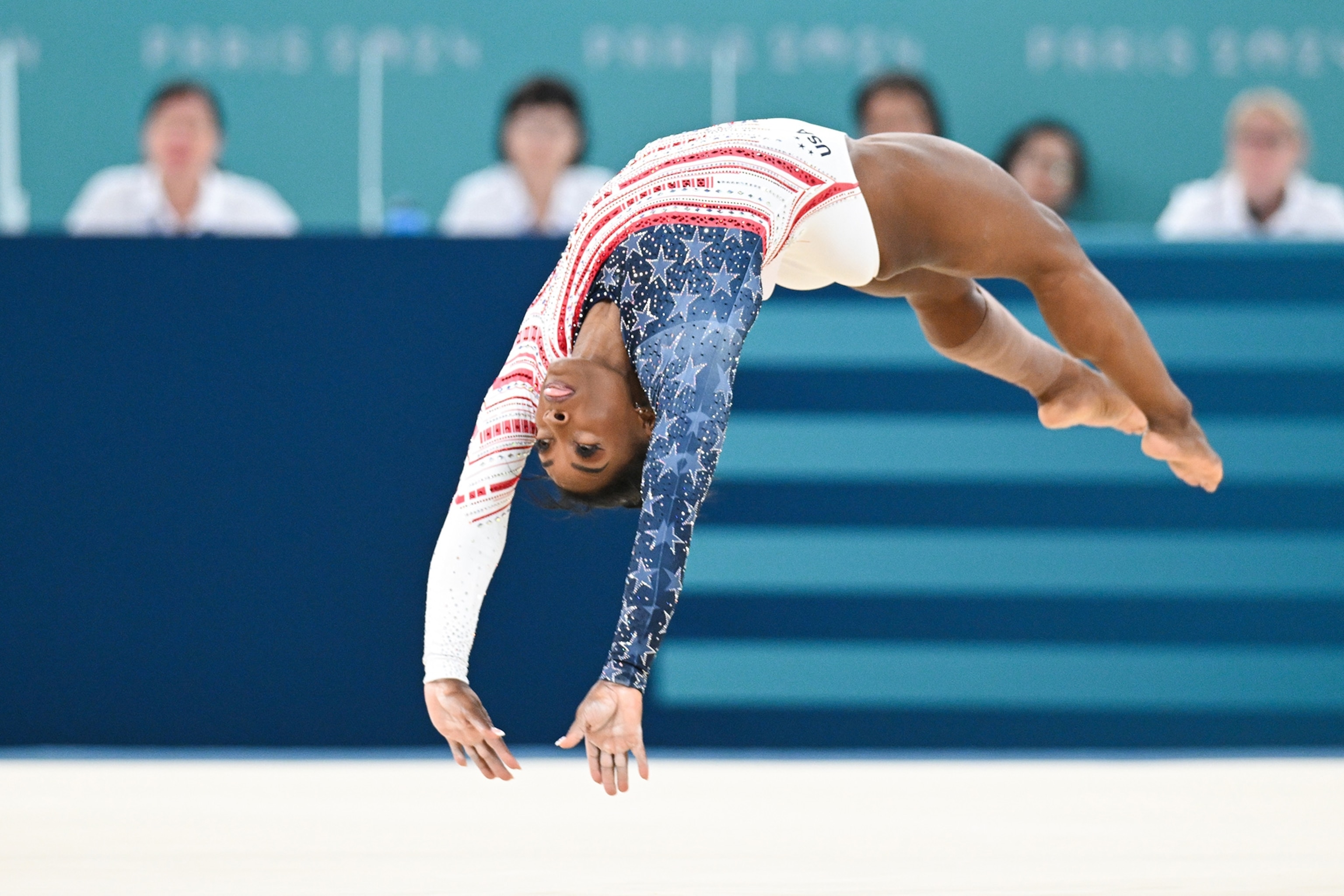Simone Biles performing on floor at the 2024 Paris Olympics.