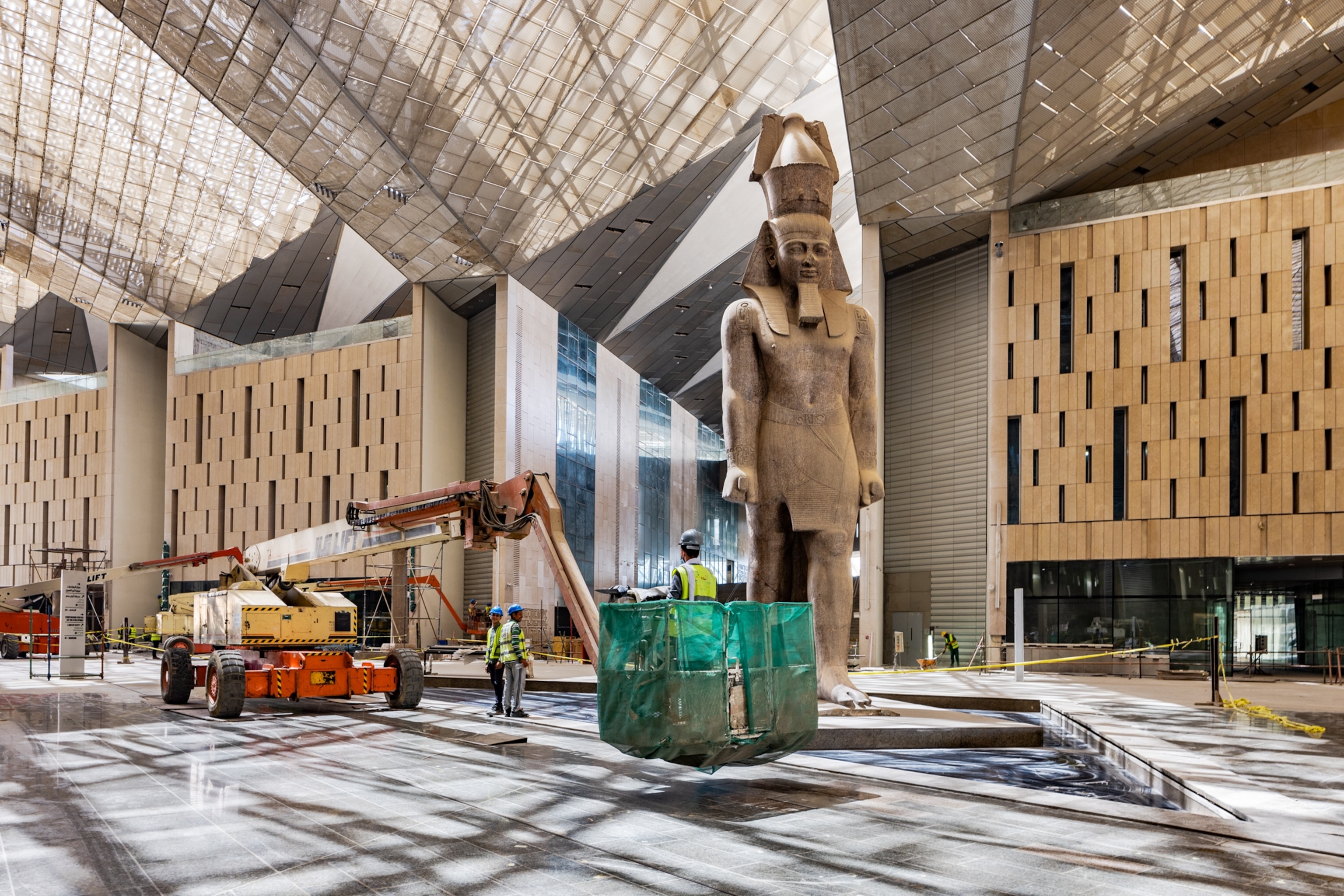 A statue of Ramses the Great within the atrium of the new Grand Egyptian Museum.