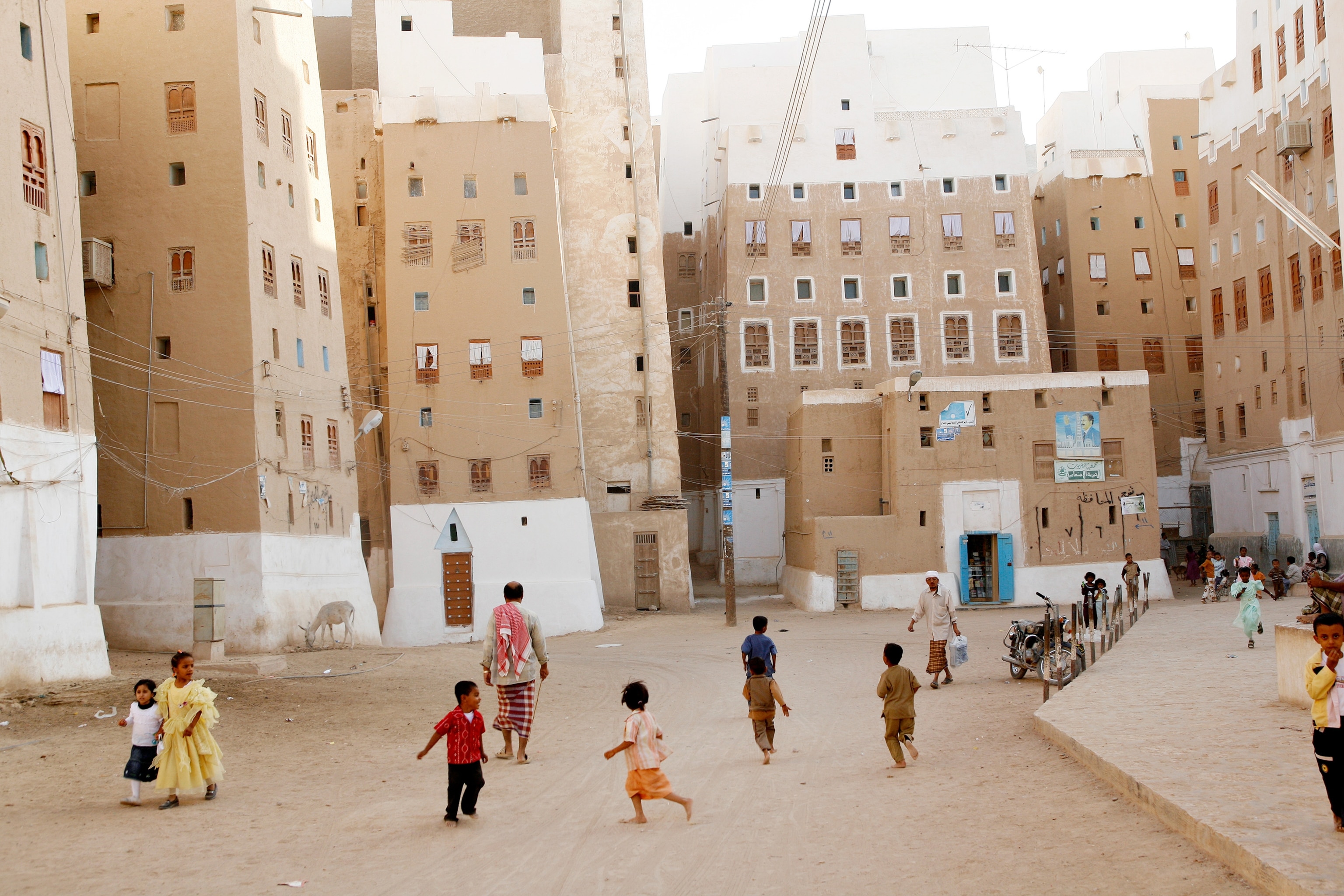 children play in the streets of Shibam, Yemen