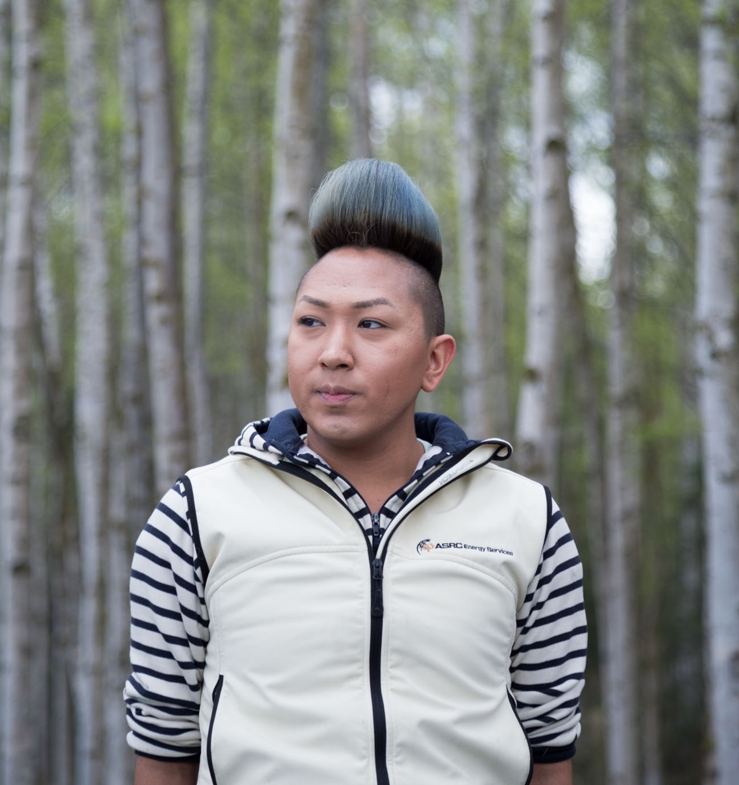 a young person posing for a portrait in nature
