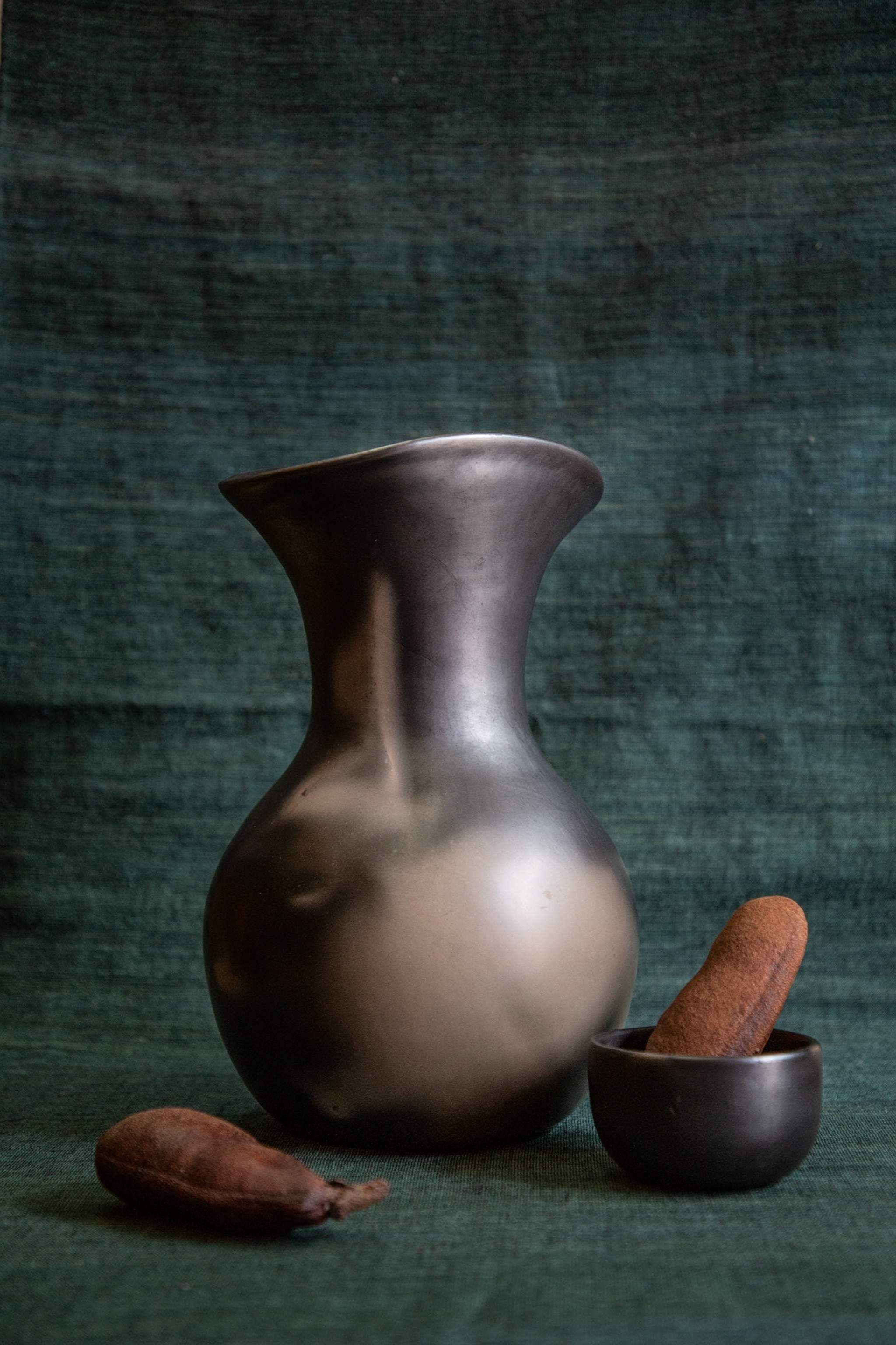 a black pottery jug