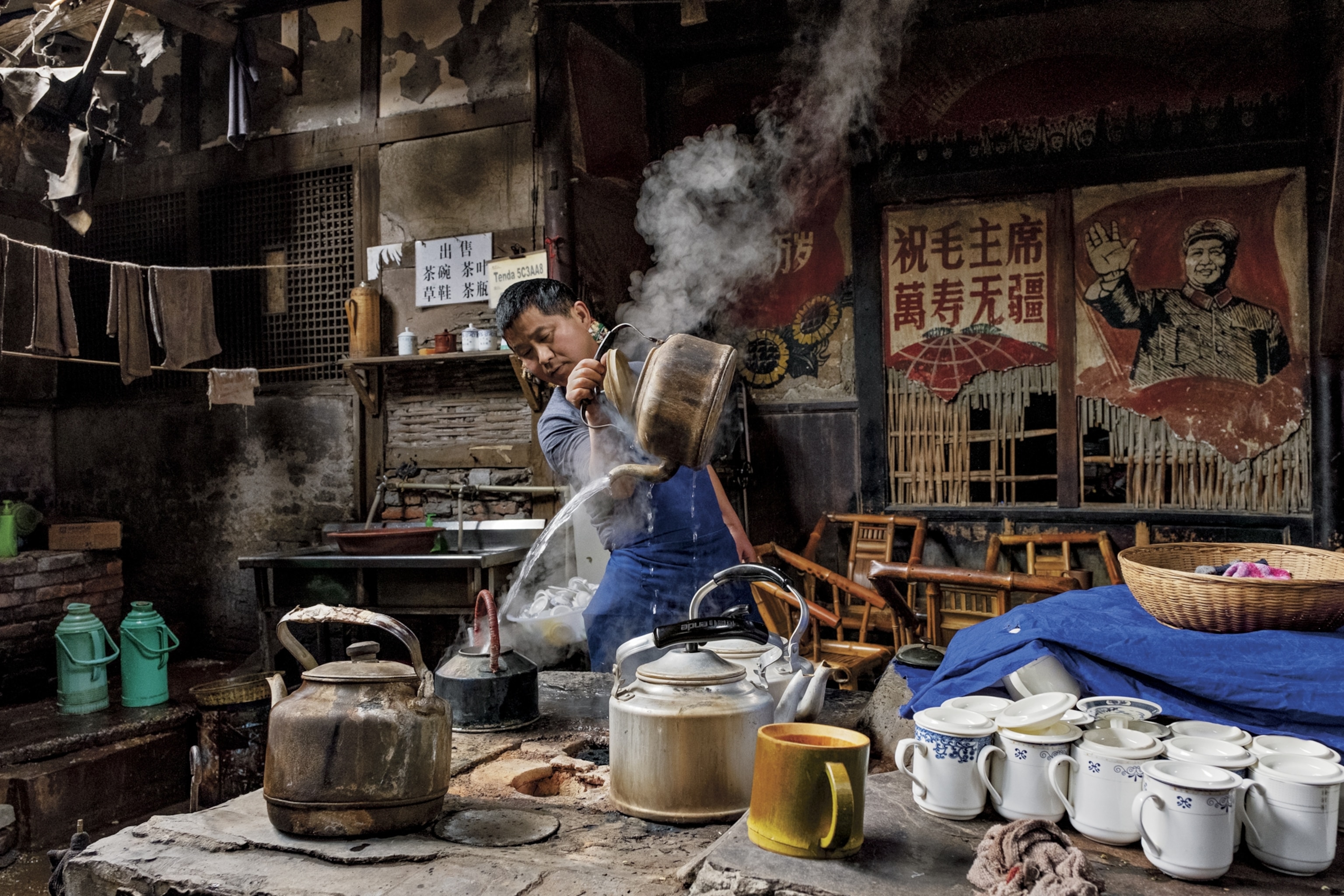 pouring hot tea Sichuan, China