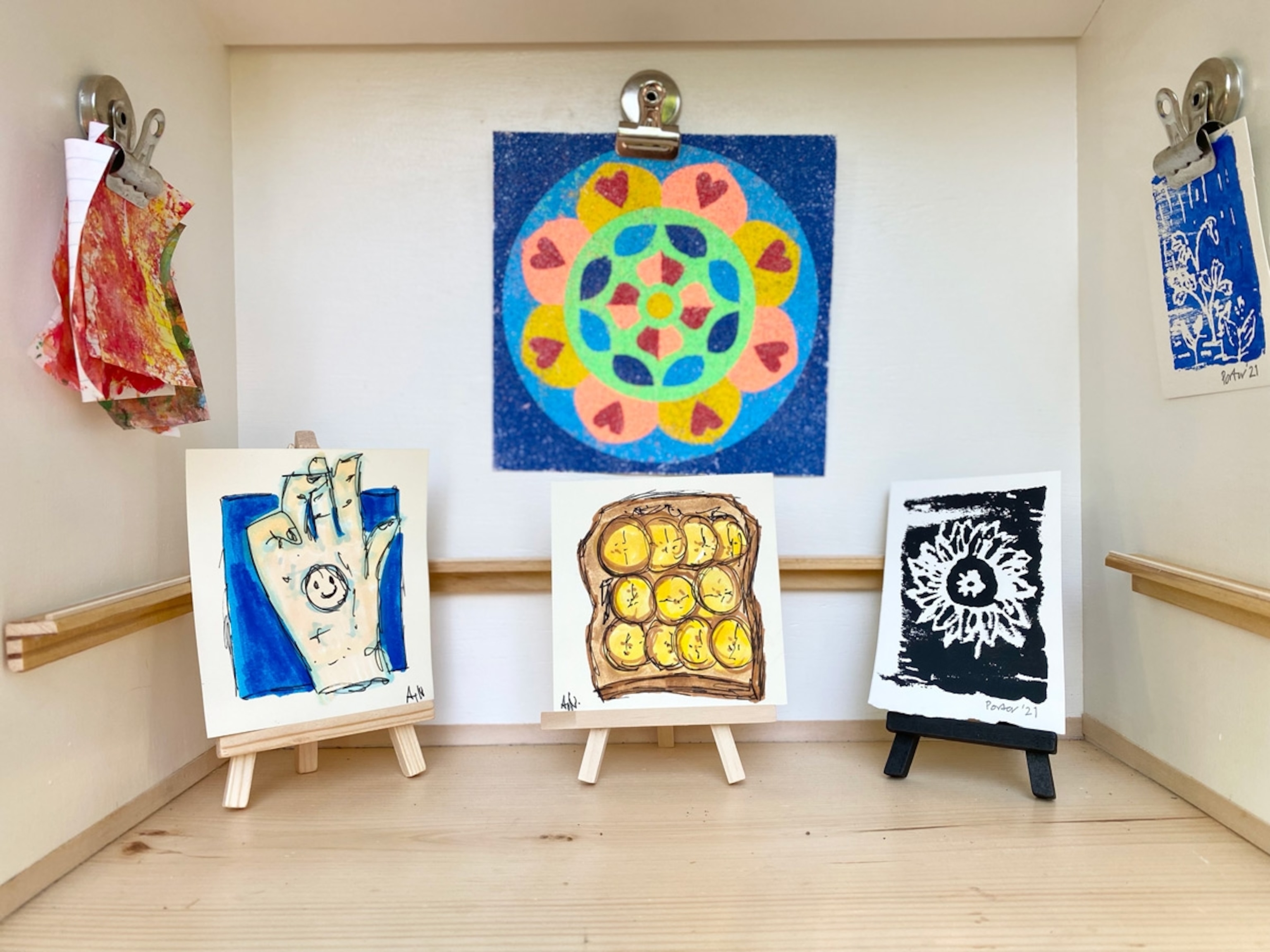 Colorful mandala on the back wall is by local DC artist Erin Thompson and her two children - Anna (age 7) and Drew (age 5). (The other art pieces were signed but illegible). FOR FLAG DC