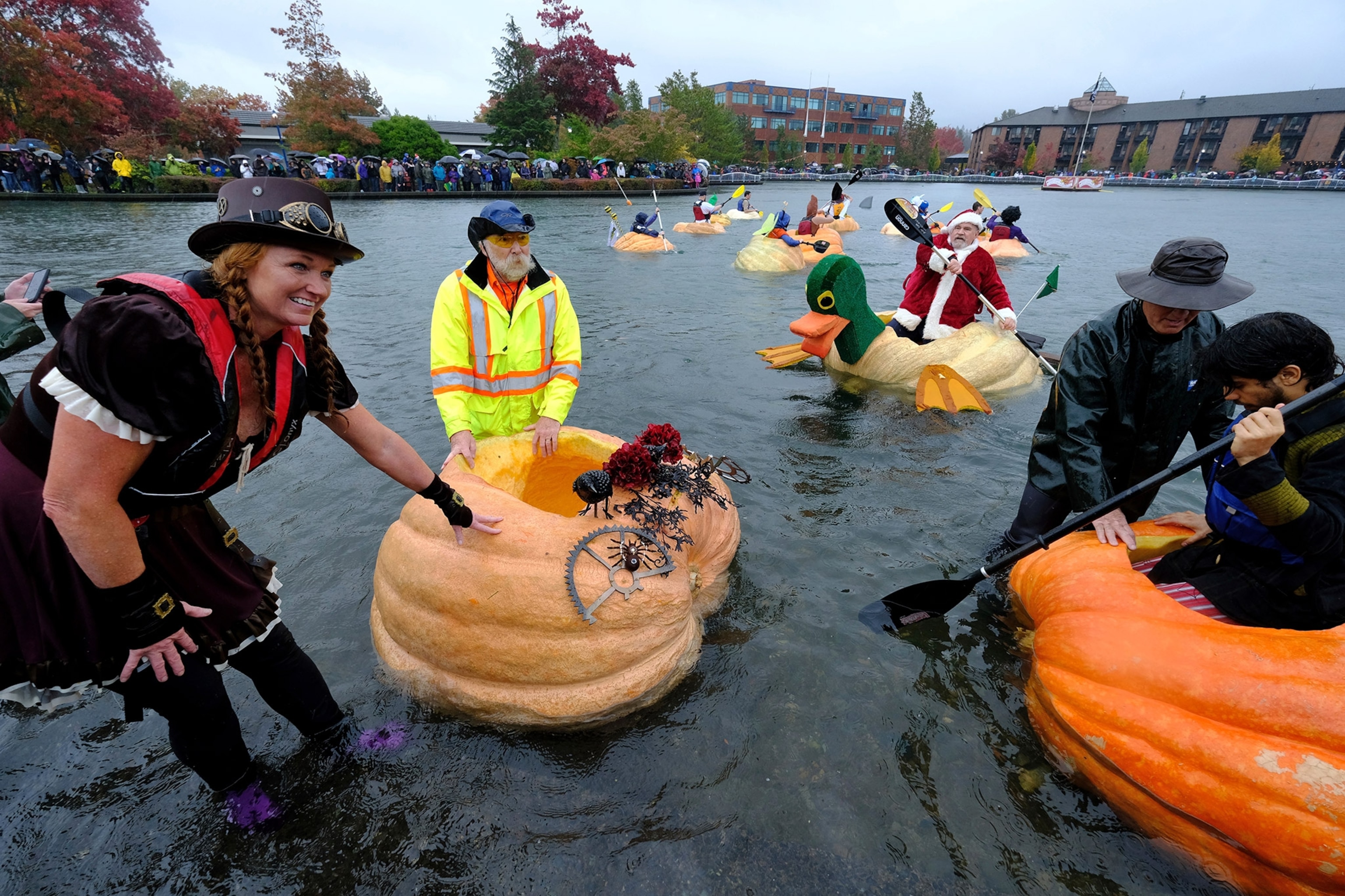 paddlers in the West Coast Giant Pumpkin Regatta in Tualatin, Oregon
