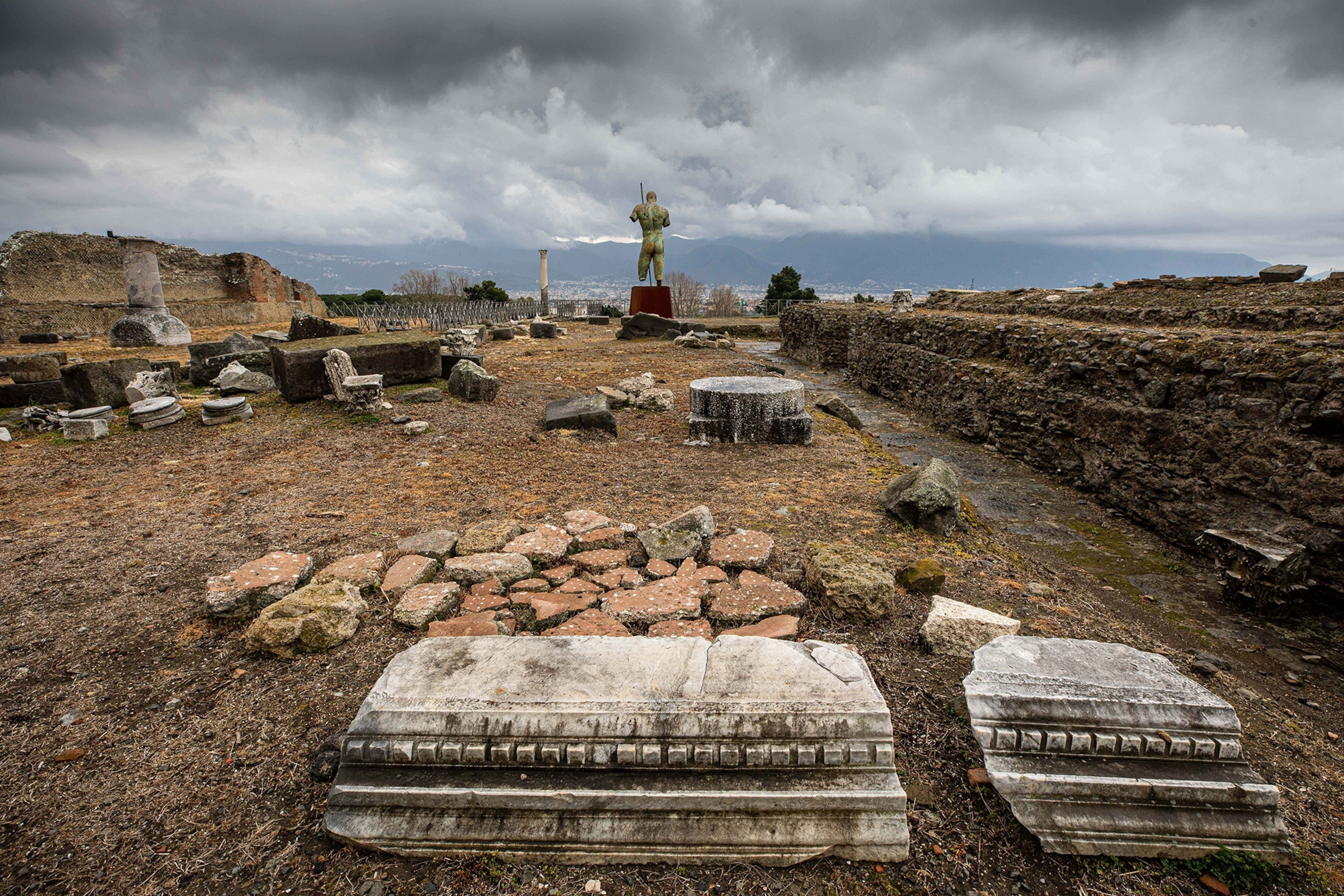 A photograph of an excavated archeological site in Pompeii, Italy.