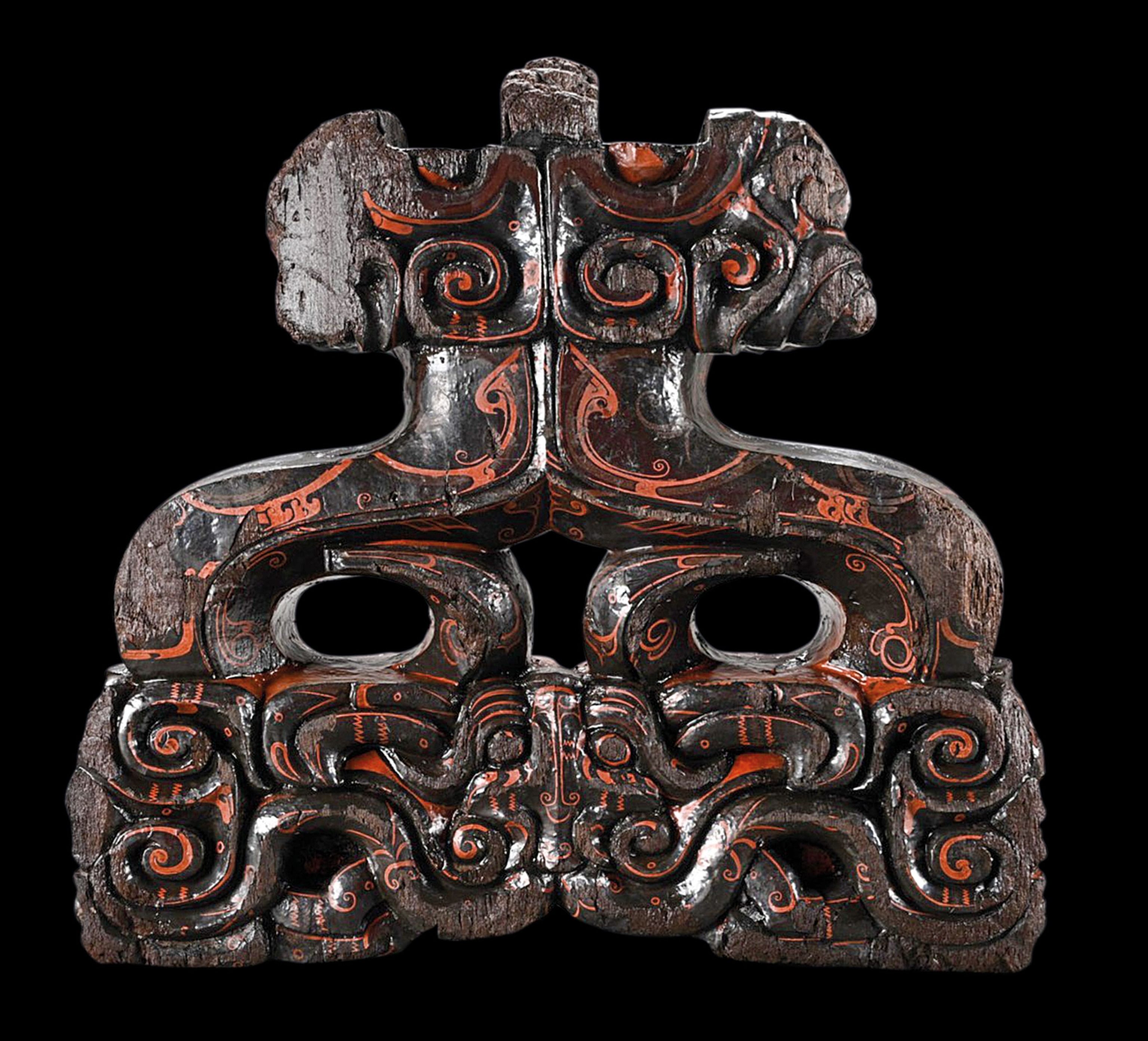 A lacquered brown and red sculpture