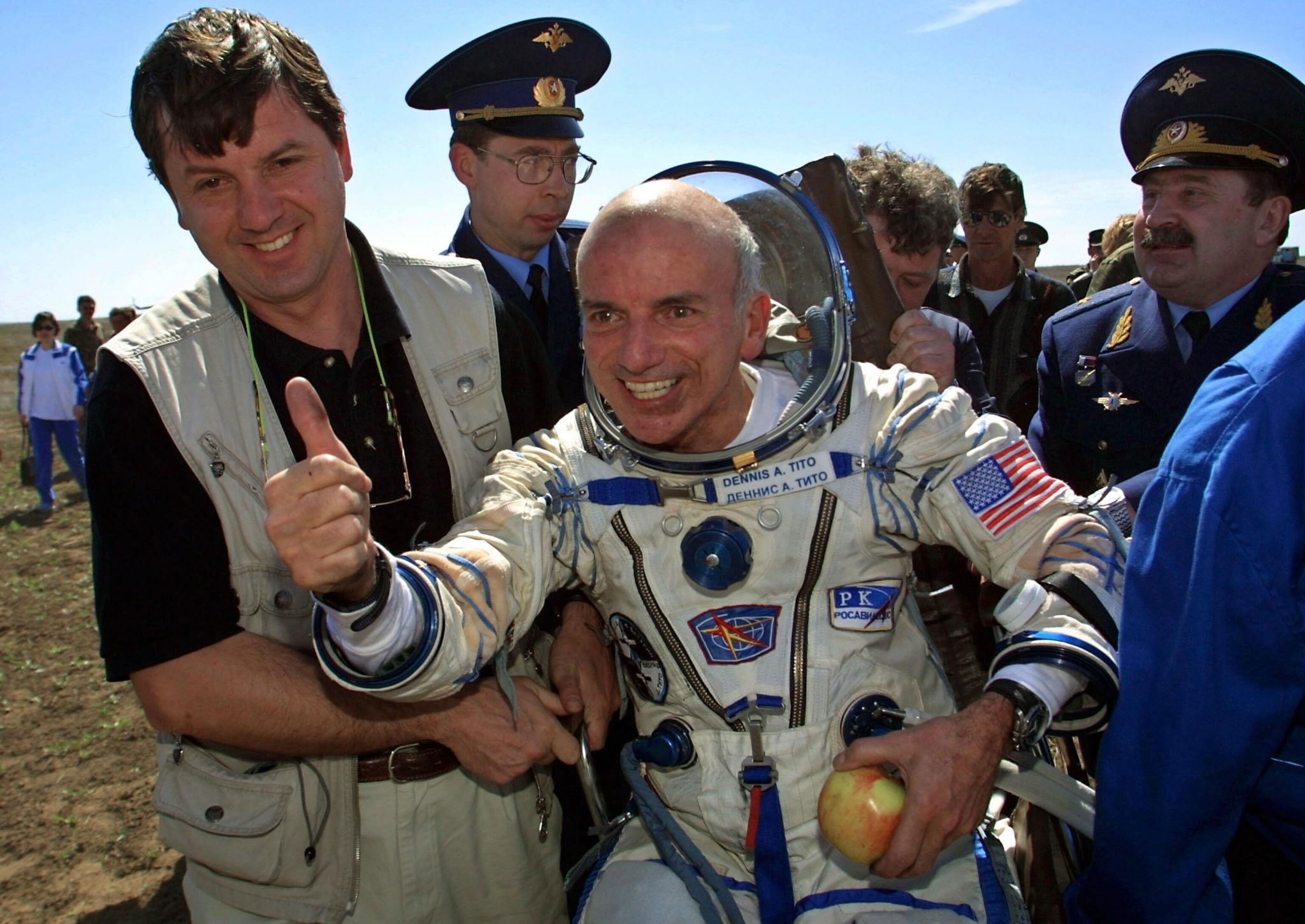 U.S. space tourist Dennis Tito celebrates after his landing in Kazakhstan.