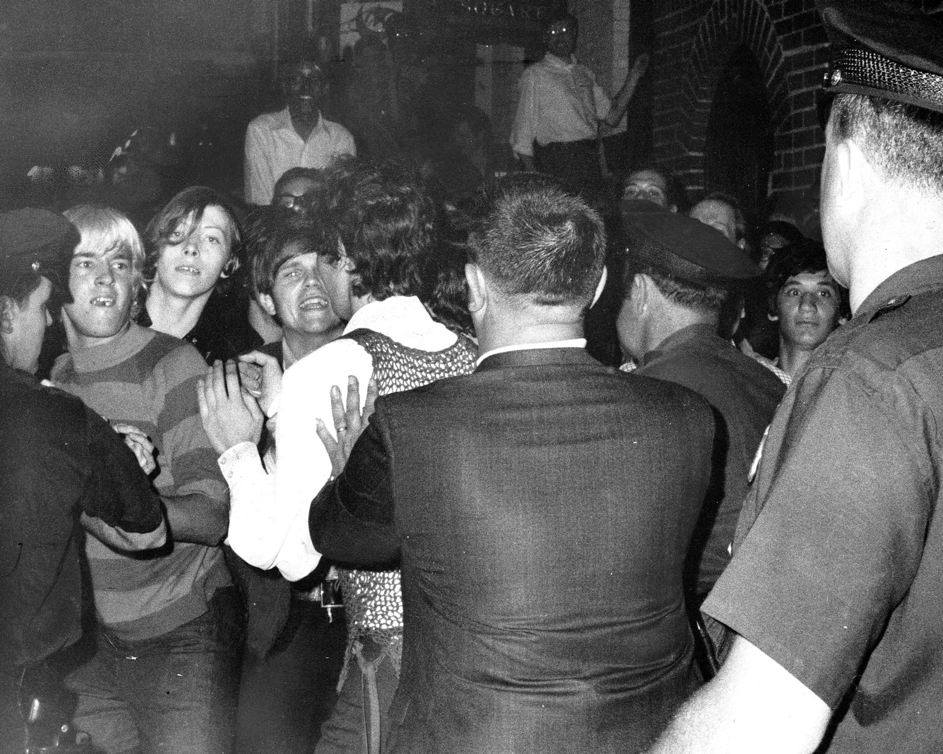 A black and white picture of a confrontation between two groups