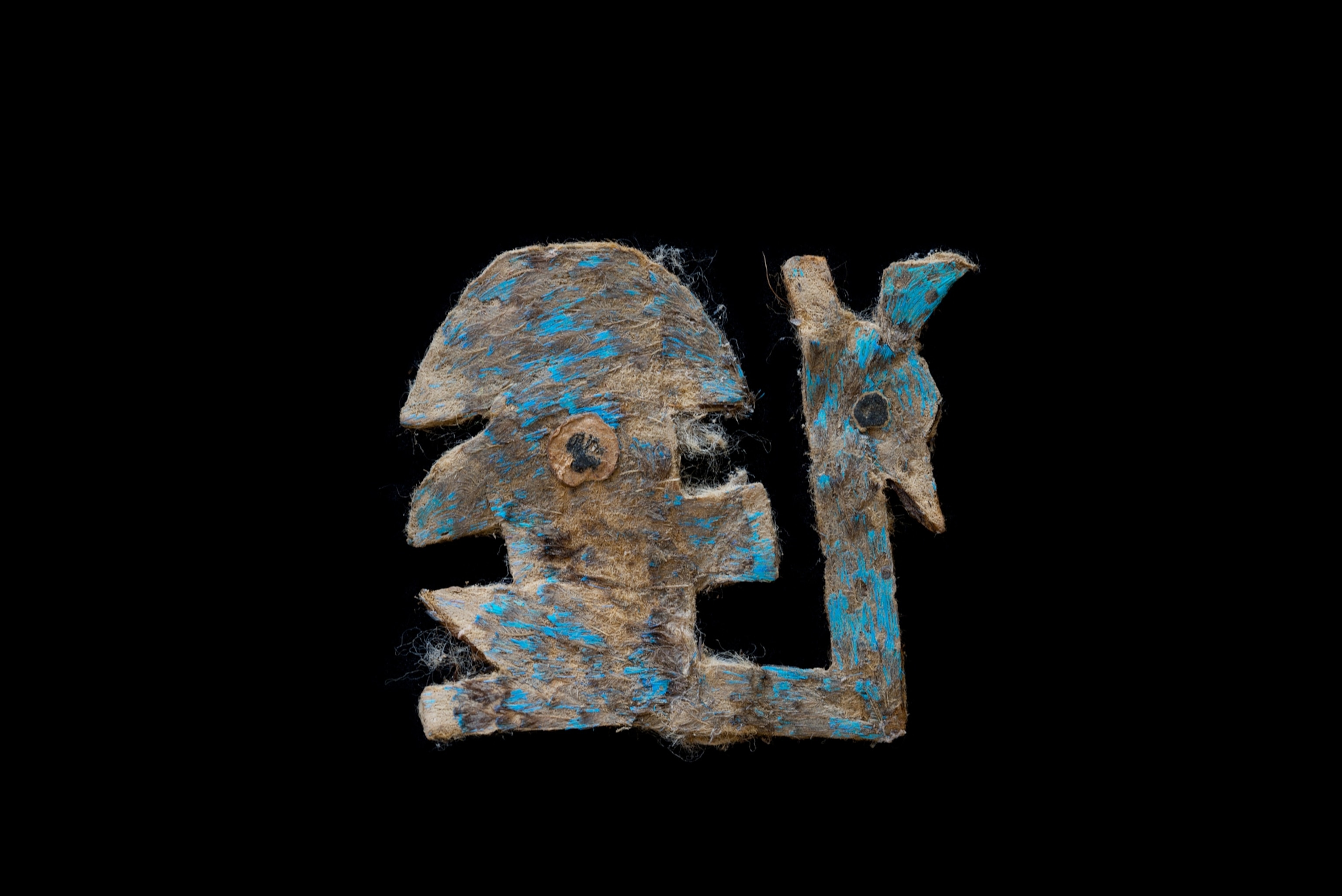piece of art that was once covered in blue feathers