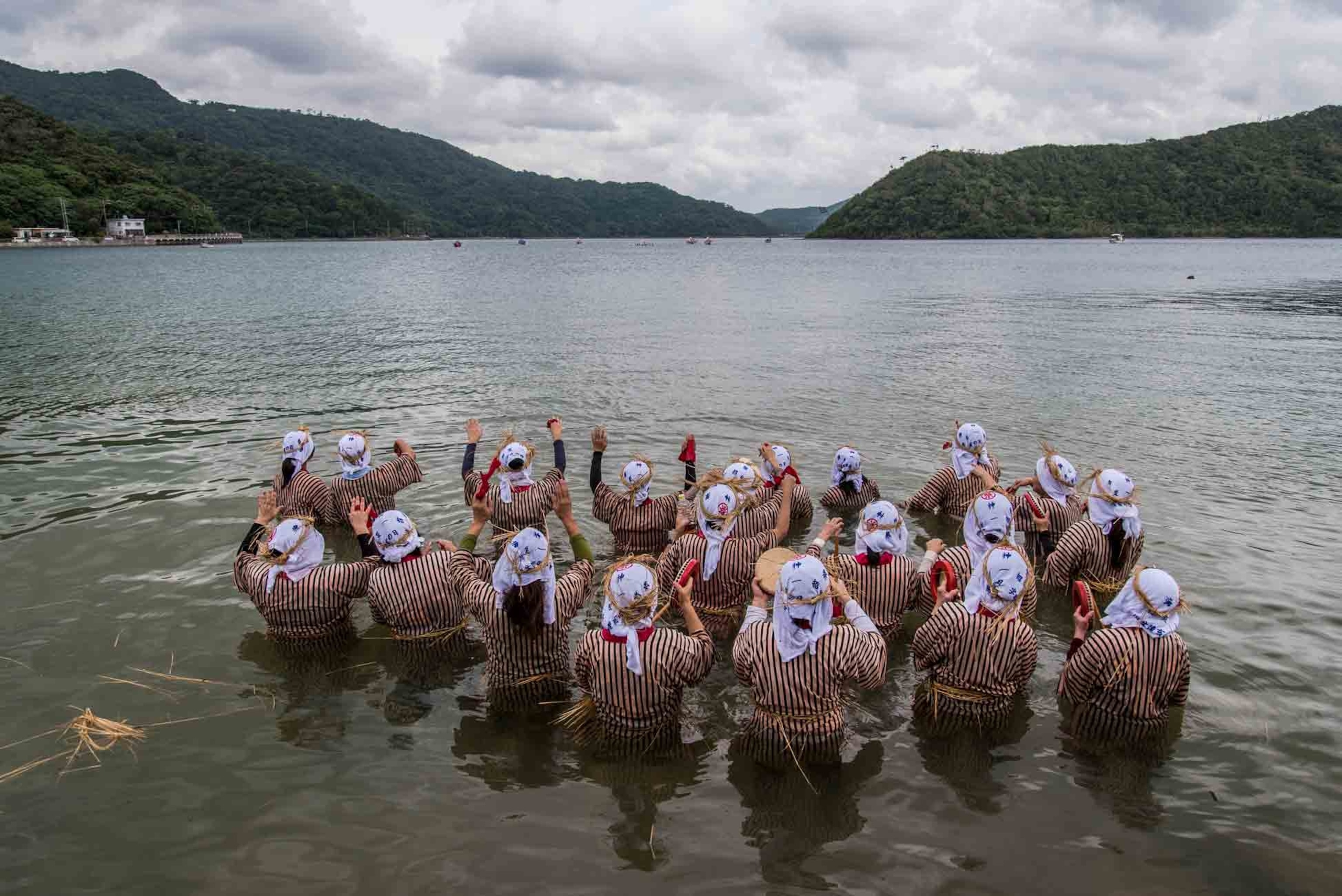 villagers participating in a ceremony of the Ungami Festival, Okinawa