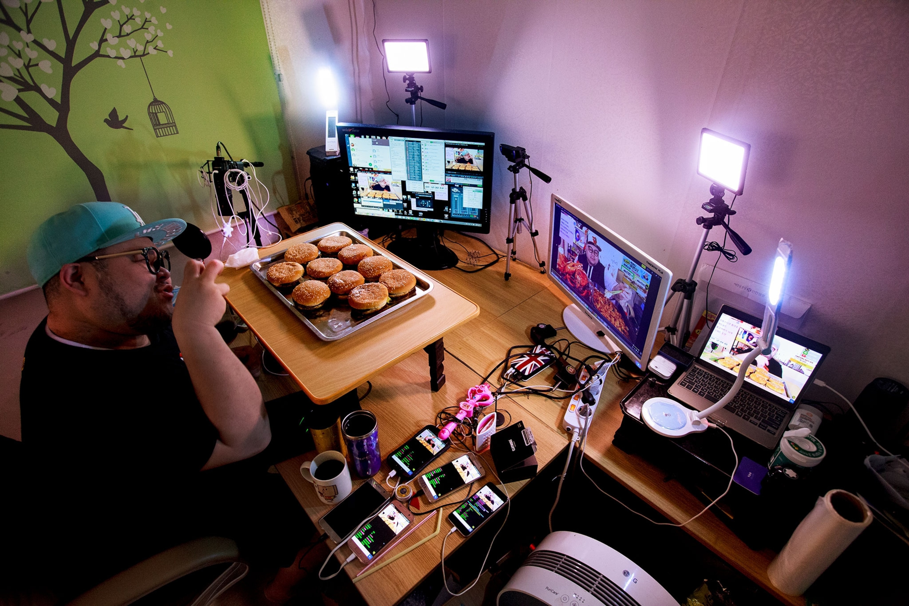 a man livestreaming while he eats in Seoul, South Korea