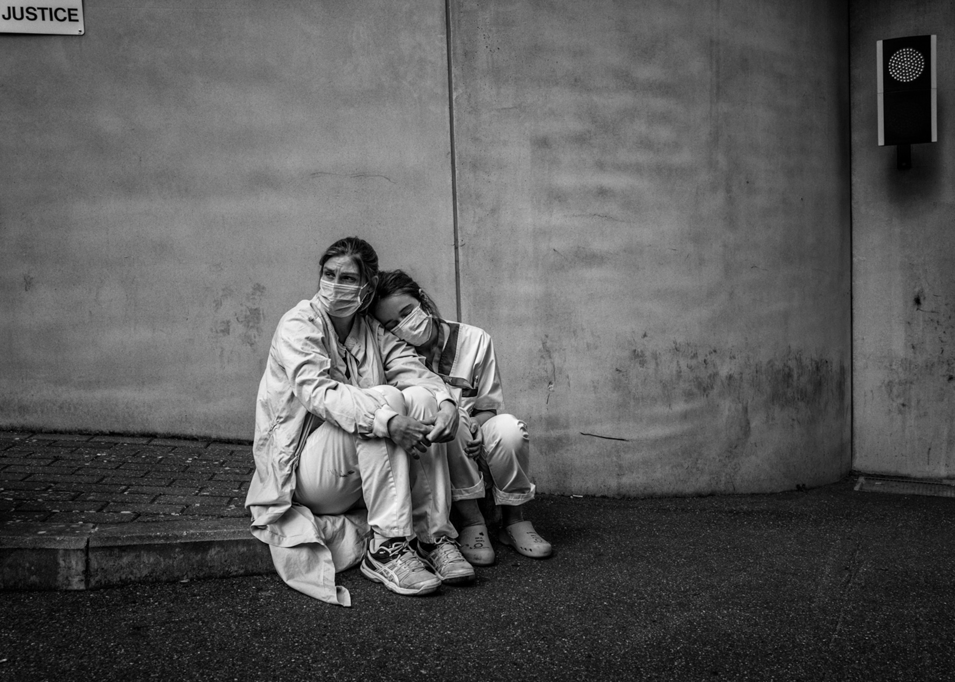 healthcare workers in Belgium take a break during a shift tending to Covid-19 patients