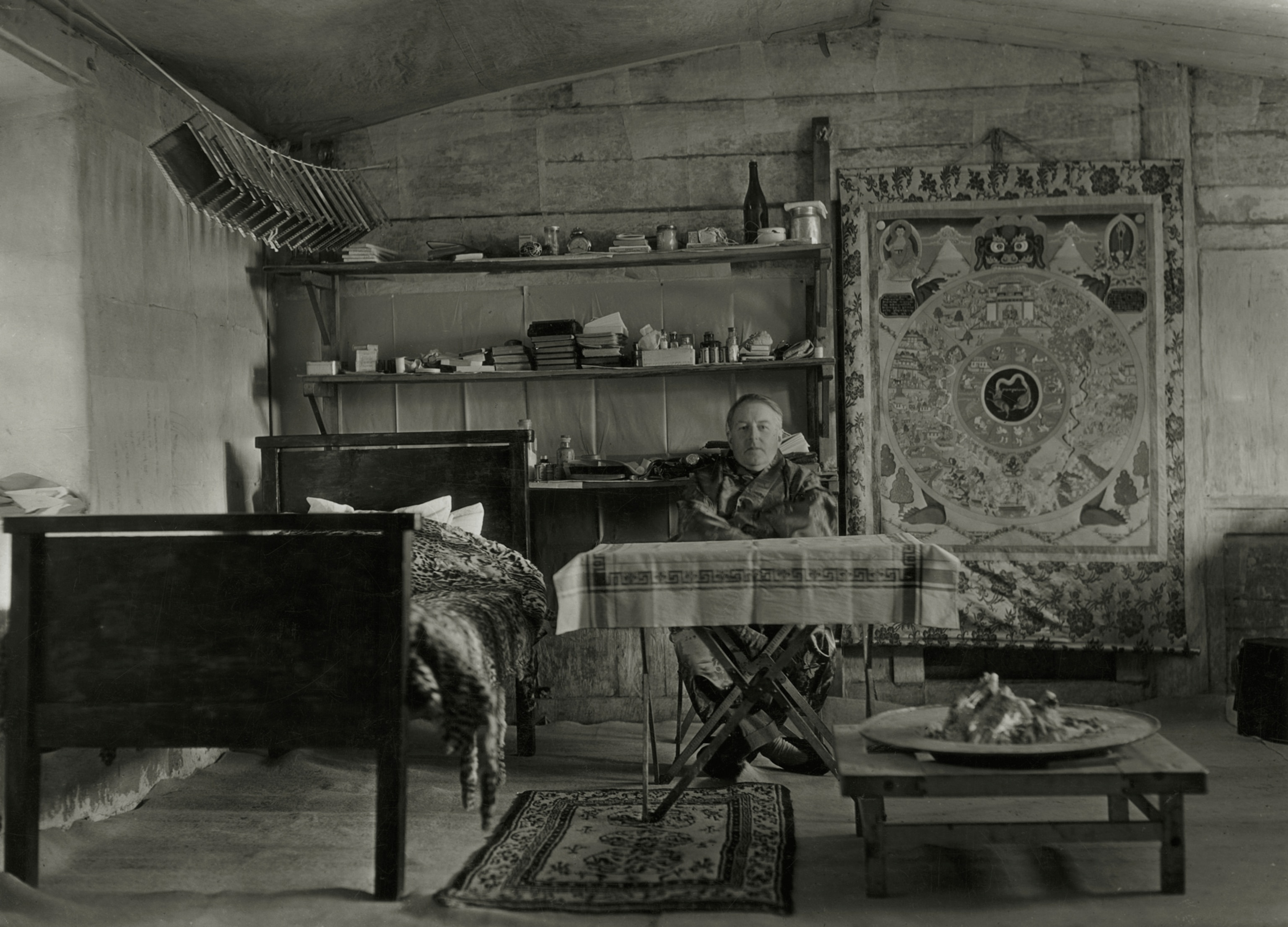Picture of man sitting behind the table in black and white