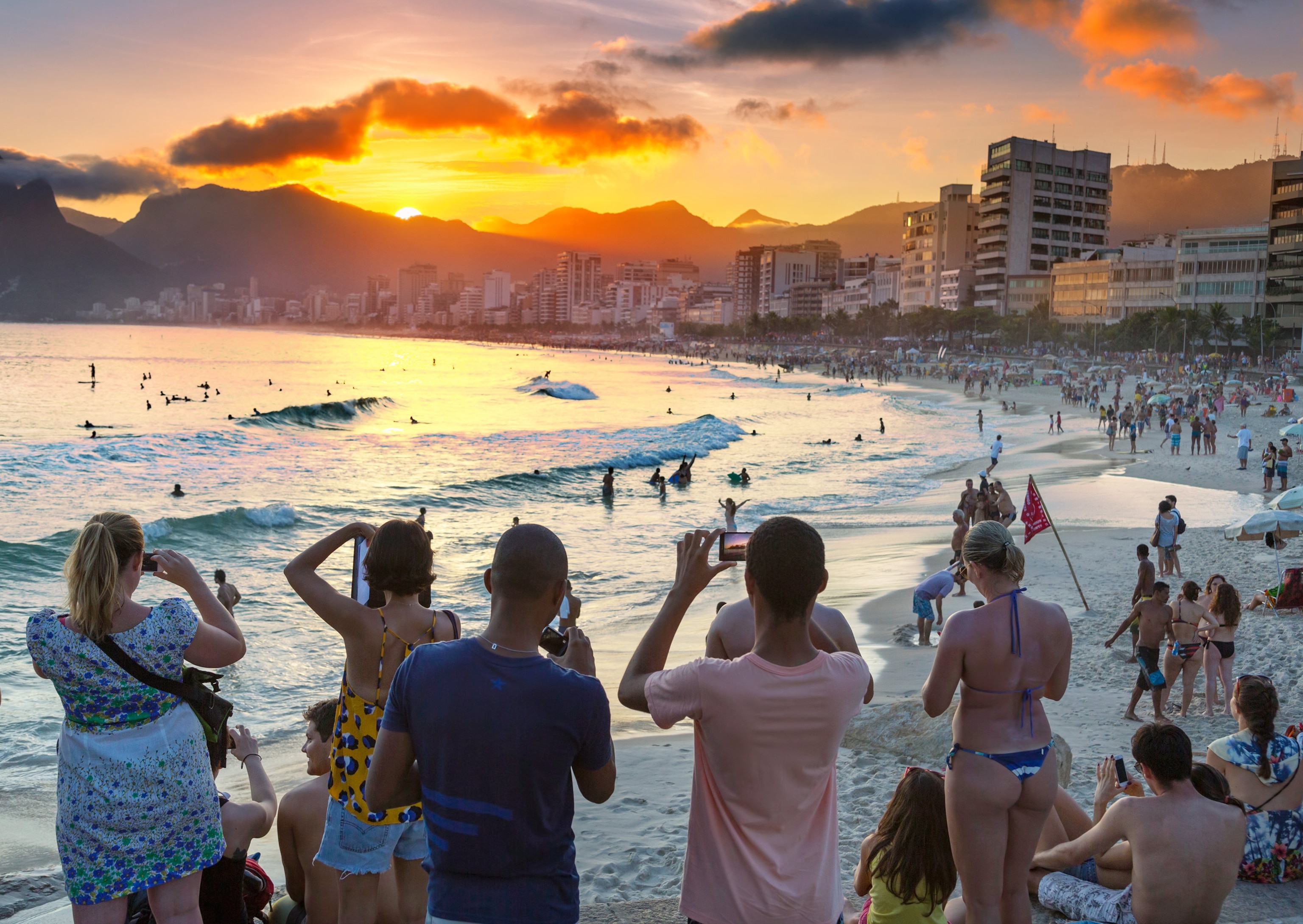 tourists taking pictures at sunset, Ipanema Beach, Rio de Janeiro, Brazil