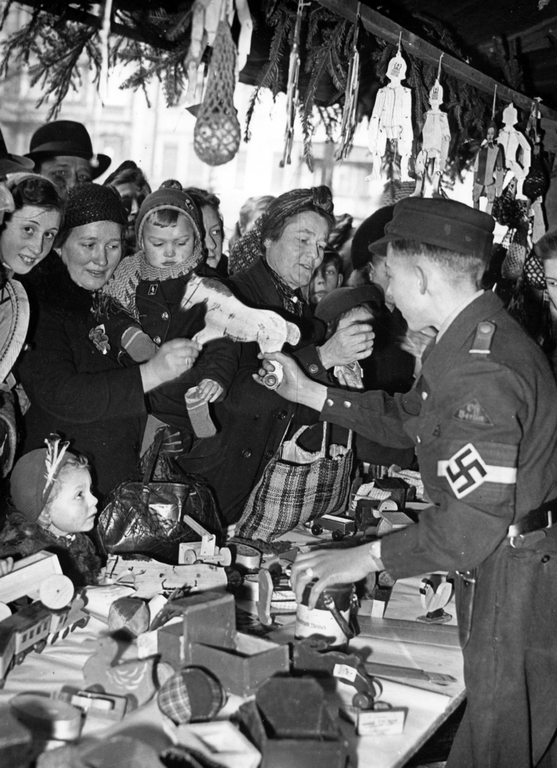 German boys and girls sell self-made toys on a Christmas market