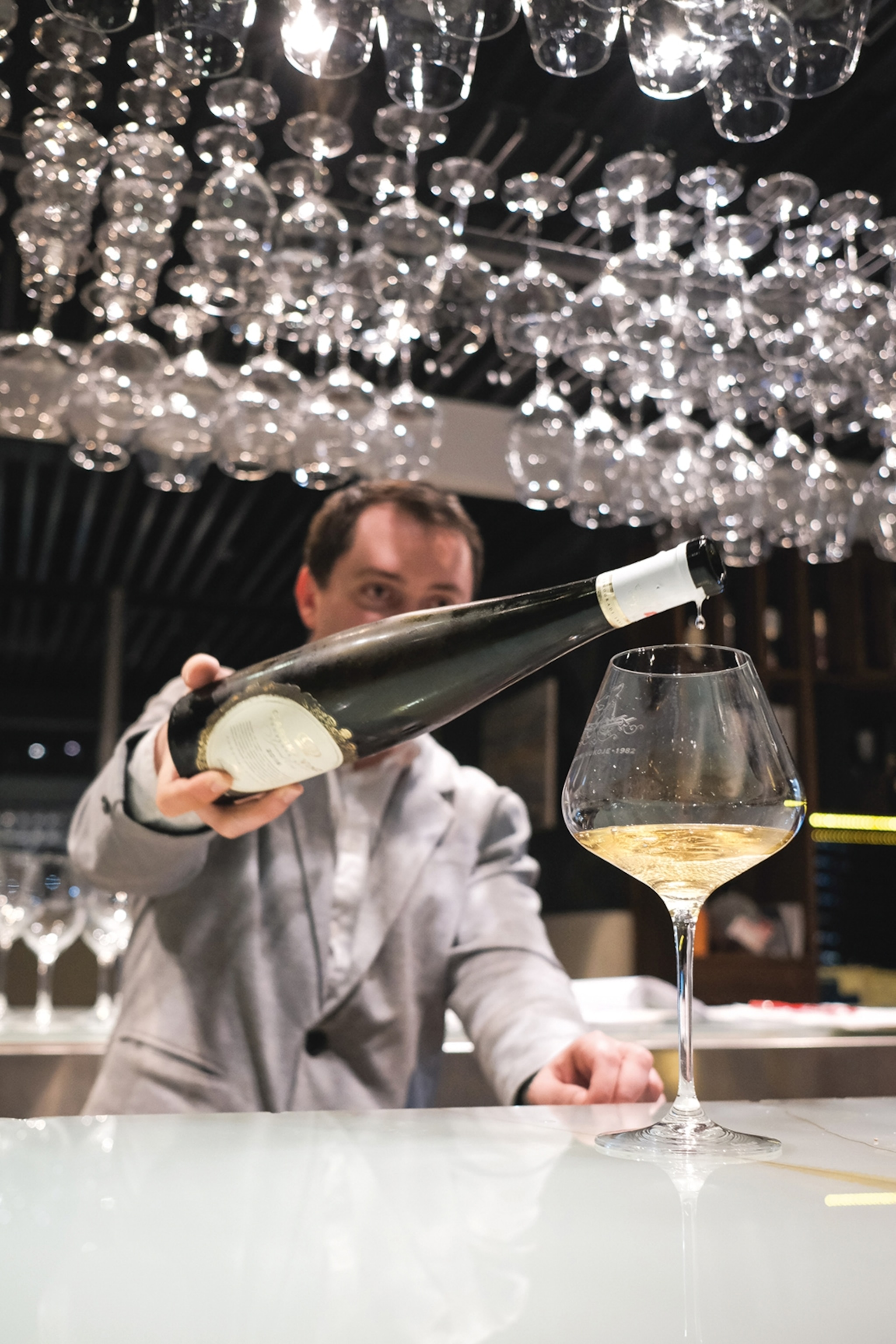 Man pouring wine into a wine glass