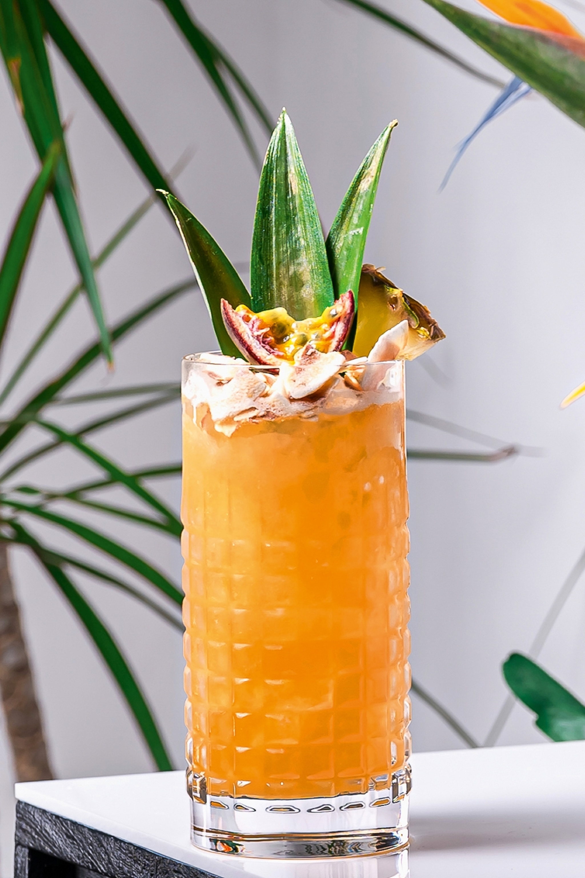 a cocktail in a tall glass