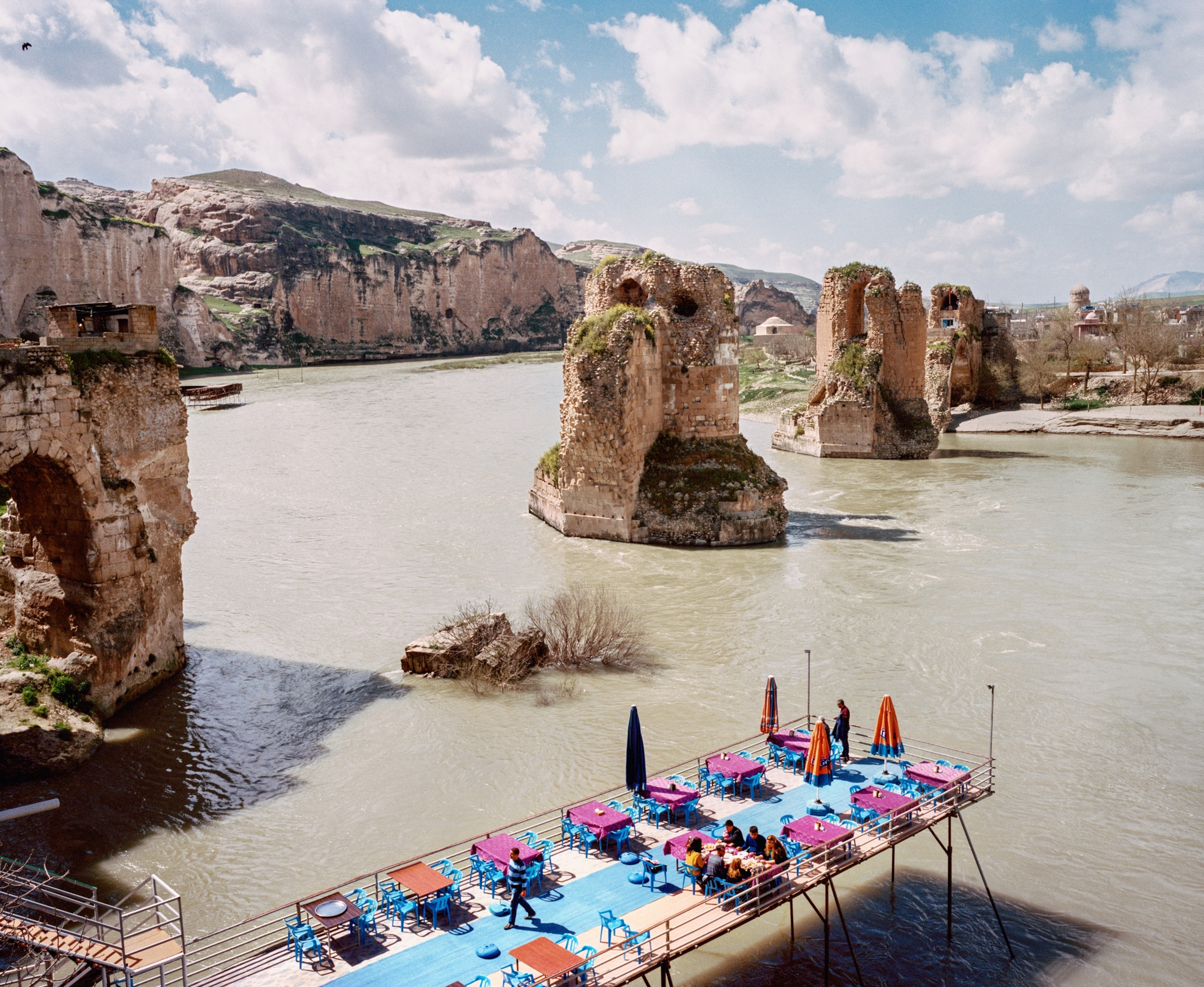modern café and the ruins of the 900-year-old bridge behind it.