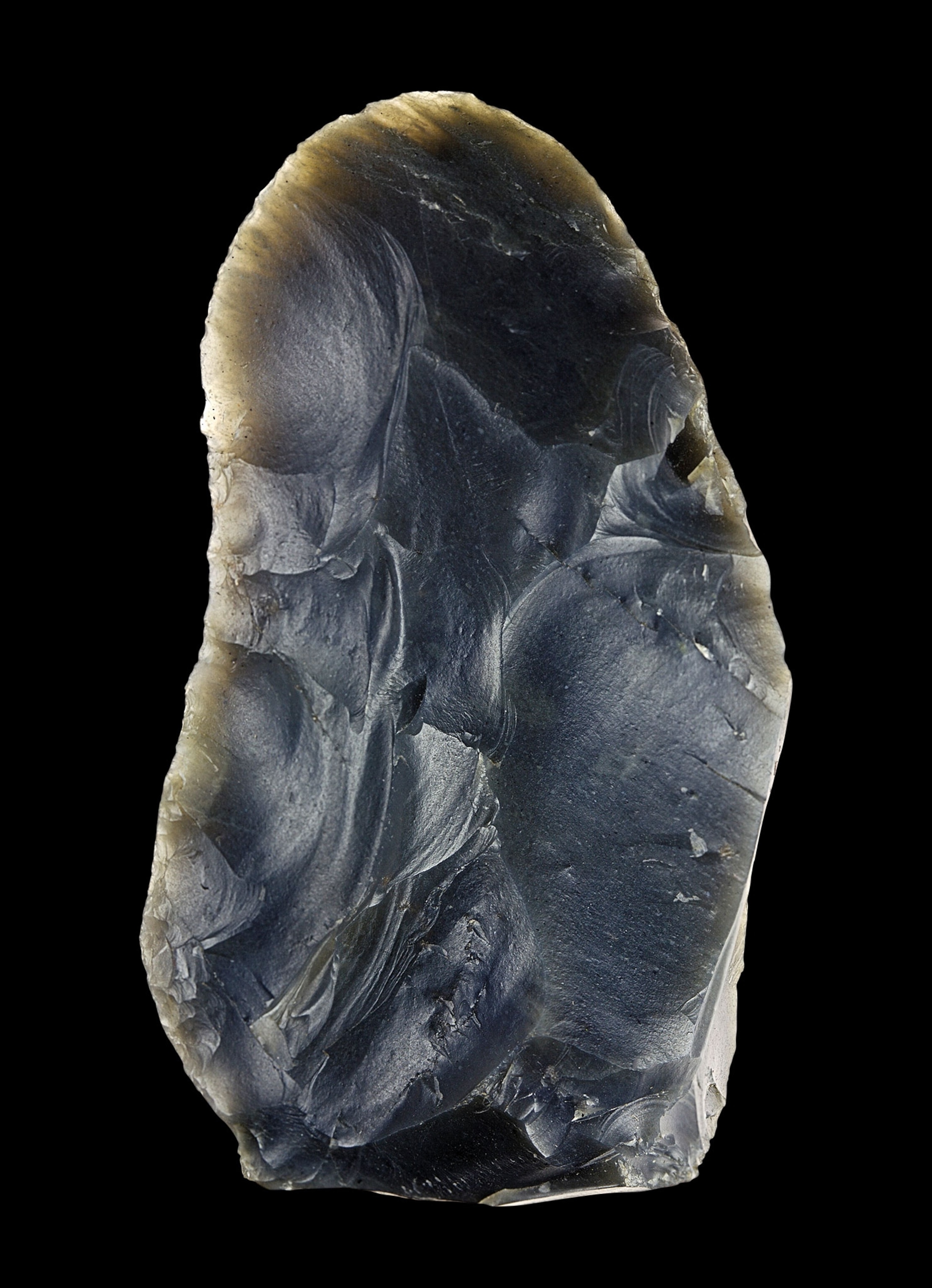 A black stone tool that has been carved