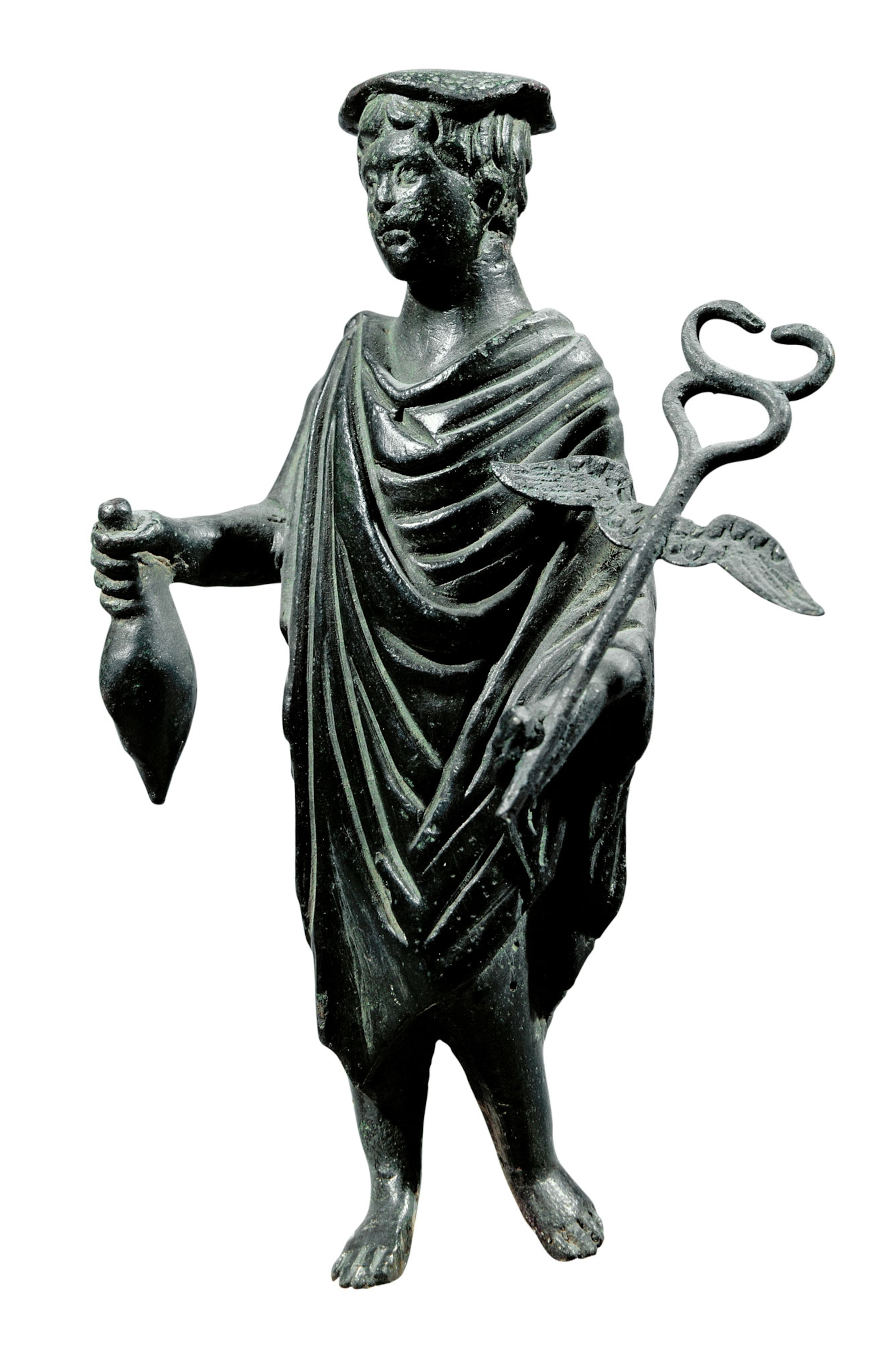 A dark statue of a person with a large staff and bag