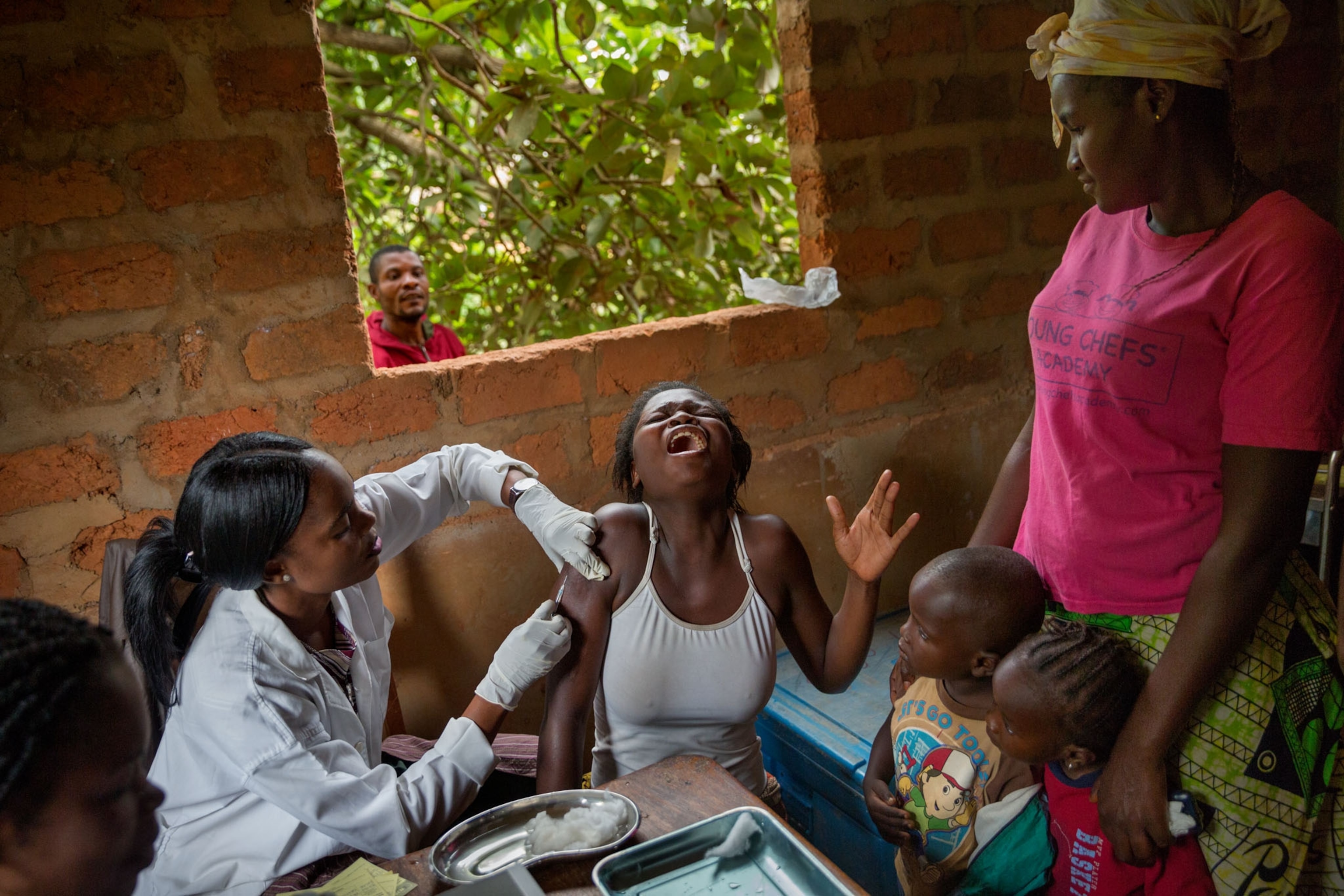 women crying during vaccination against yellow fever, Matadi, DRC.