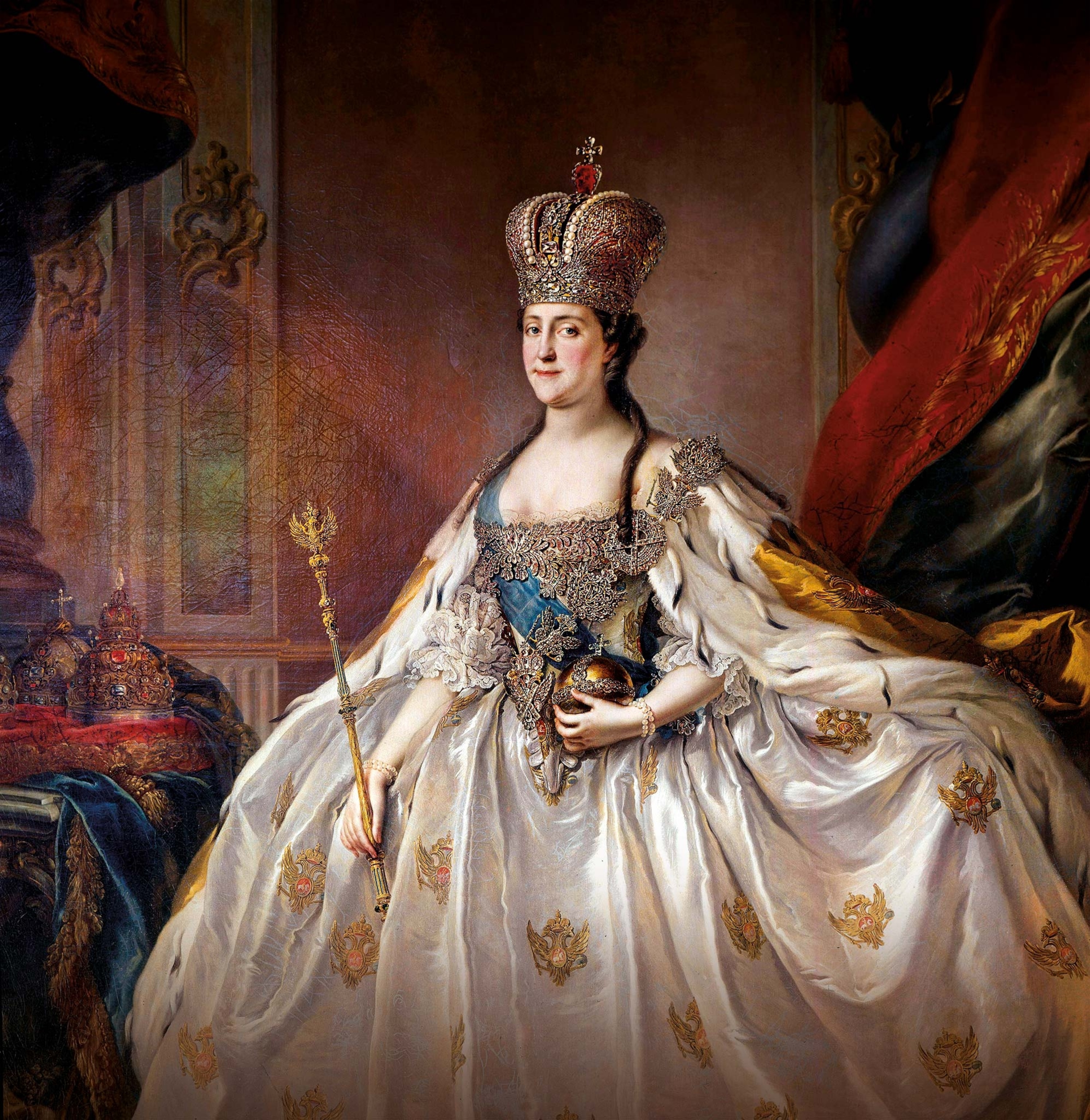 Catherine’s coronation portrait shows her in all her imperial splendor. Topped by a sparkling diamond crown, she displays the royal regalia and is draped with the blue sash of St. Andrew, the highest honor of the Russian Empire.