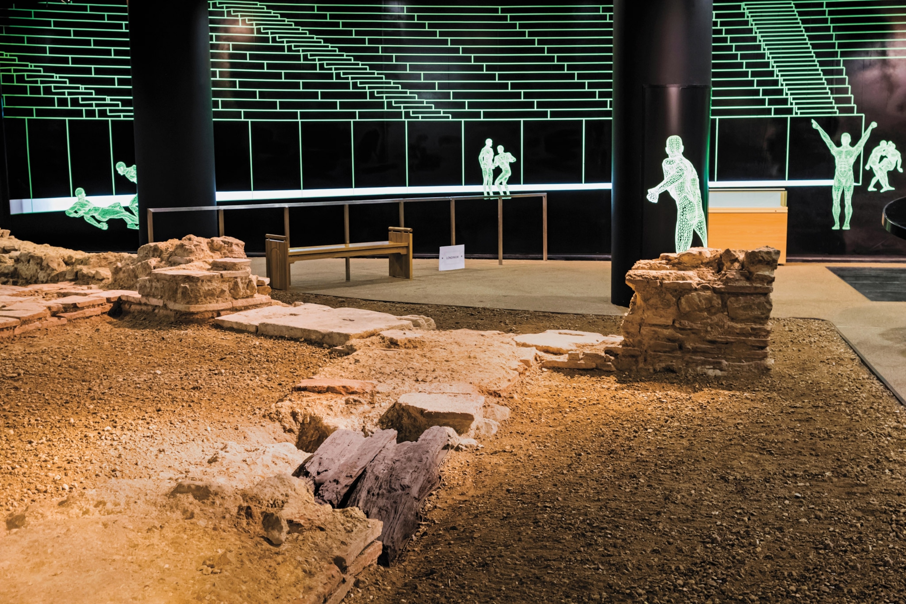 Photo of ruins on ground in museum exhibition