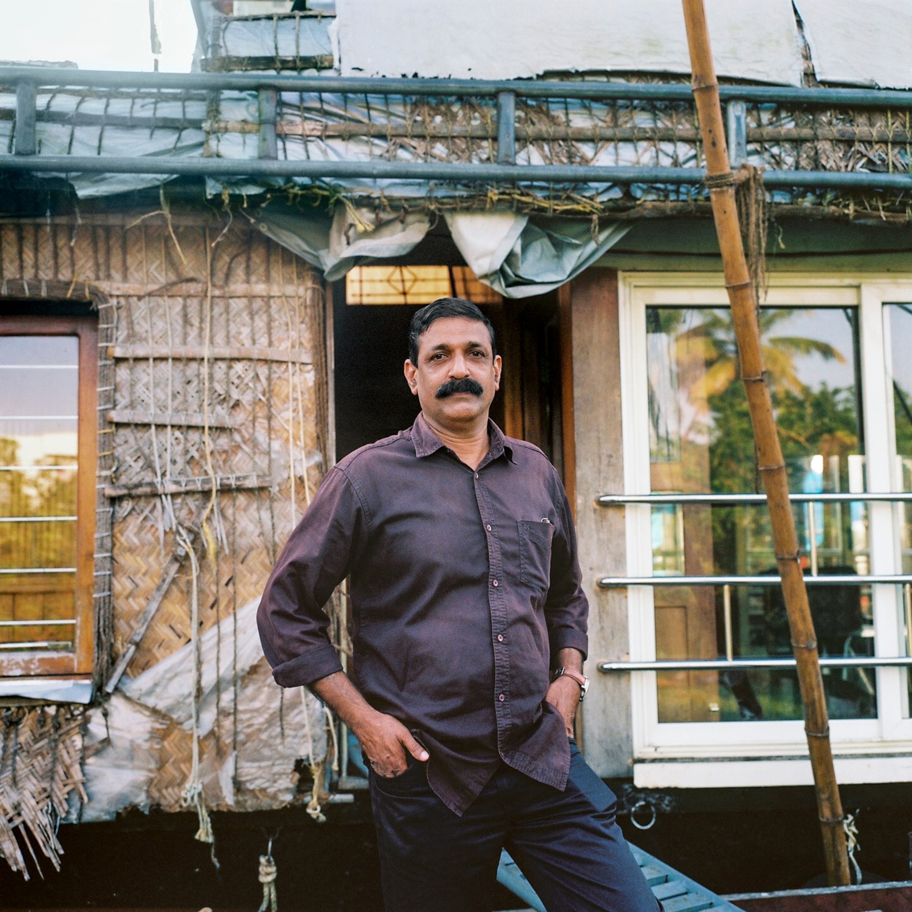 Subhash Raghavan, houseboat operator and operator in Alleppey, Kerala poses for a portrait