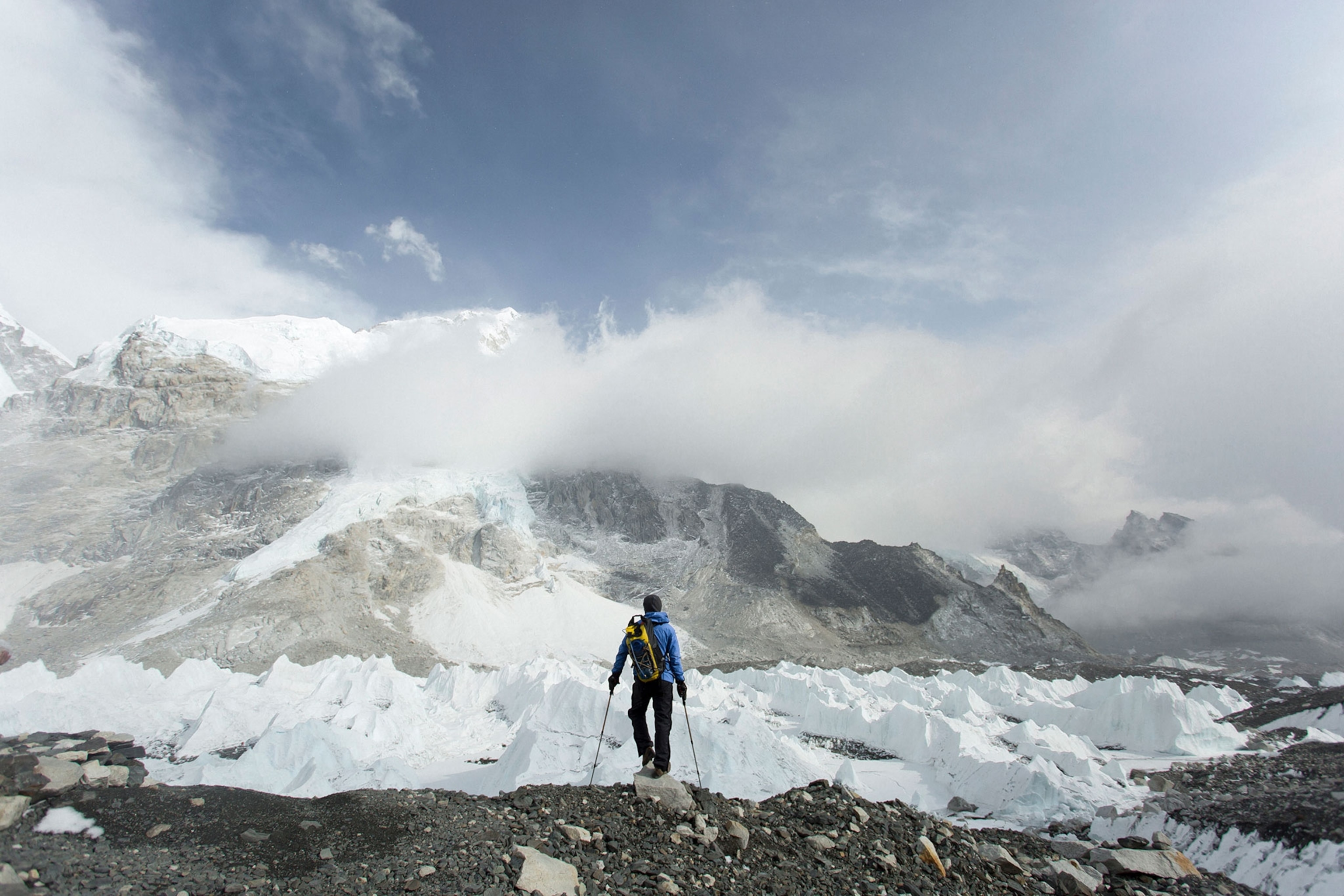 a hiker looking at the Khumbu Glacier see from Everest Base Camp, Nepal