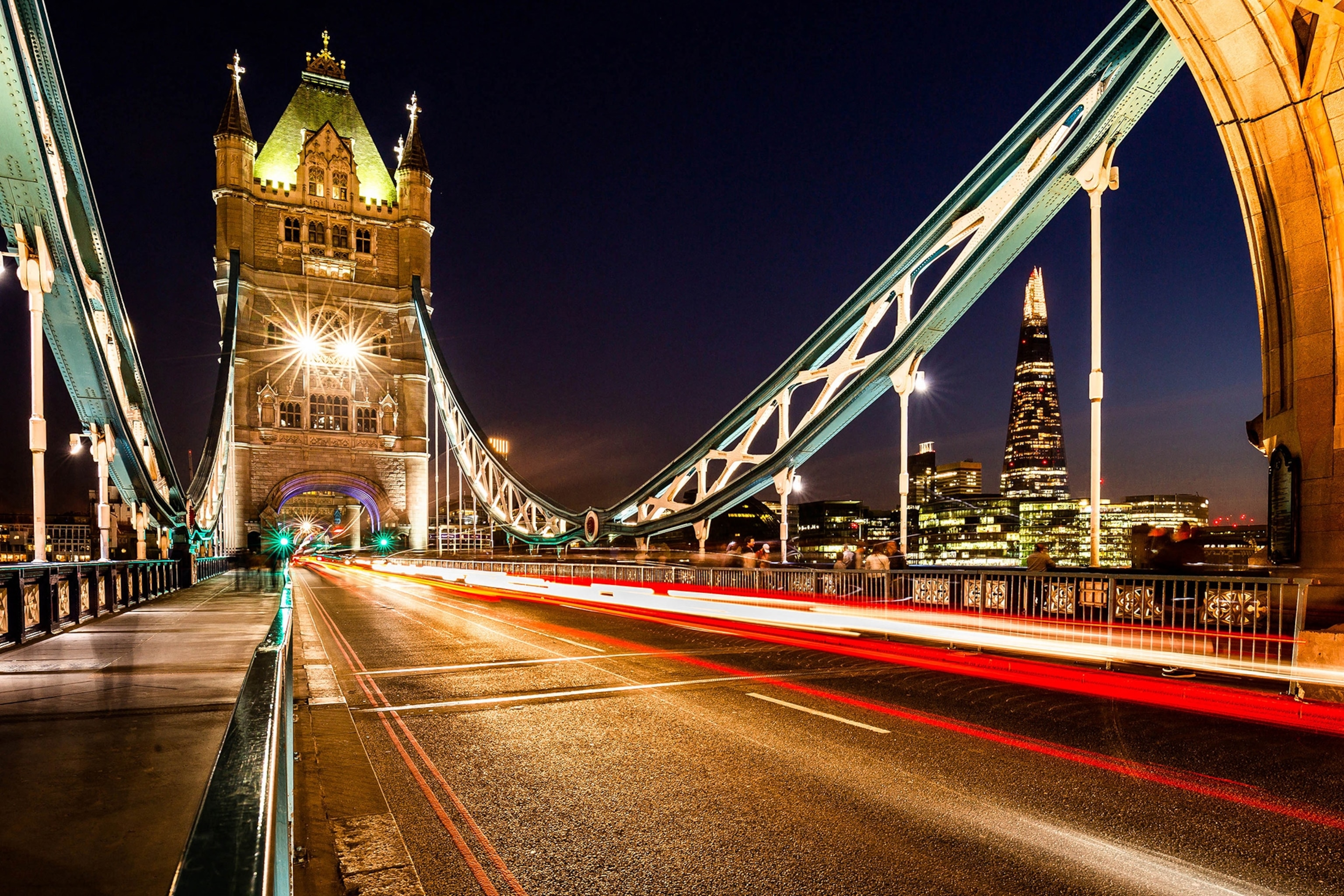 Tower Bridge at sunset with view on the Shard in London.