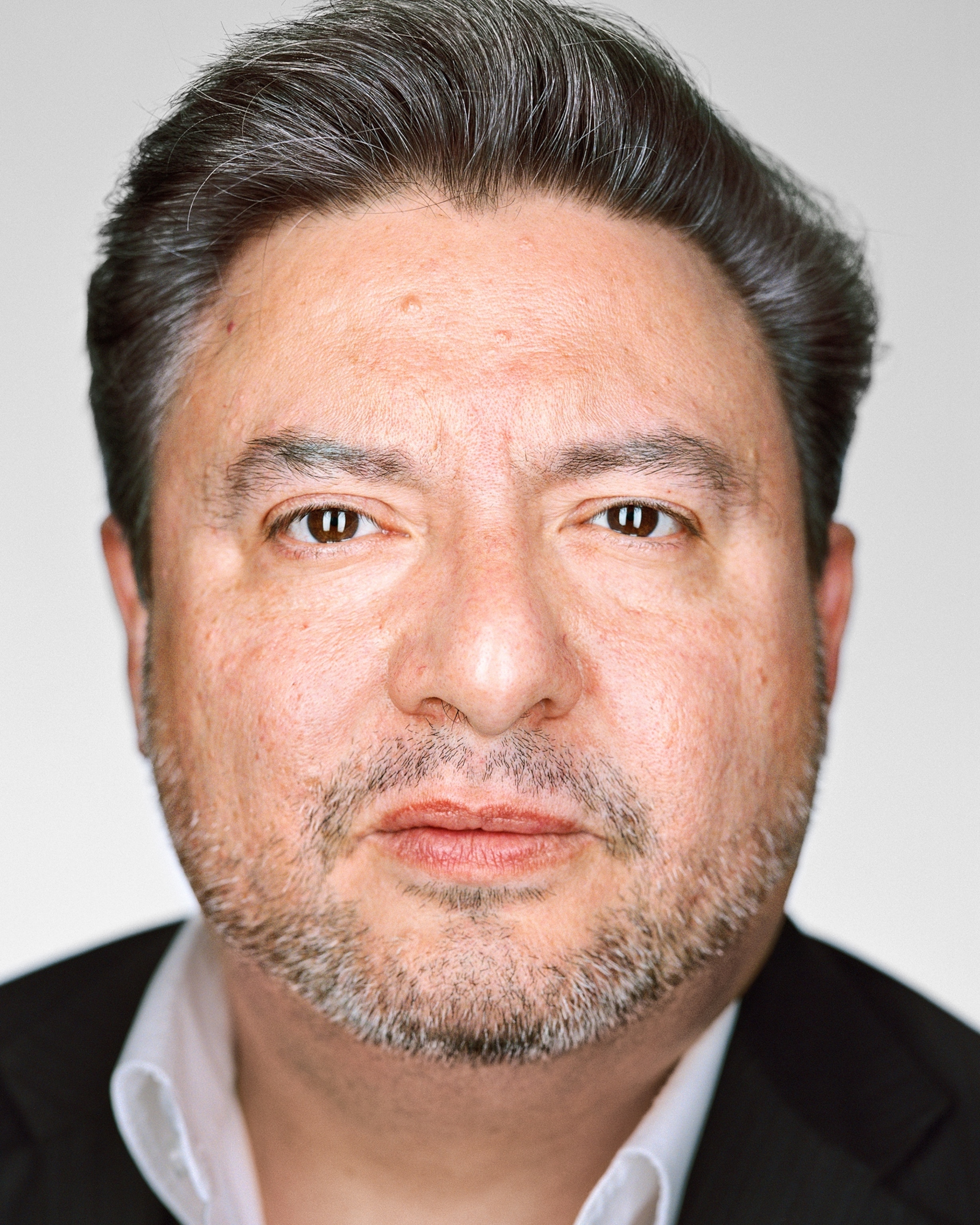 man with short beard.