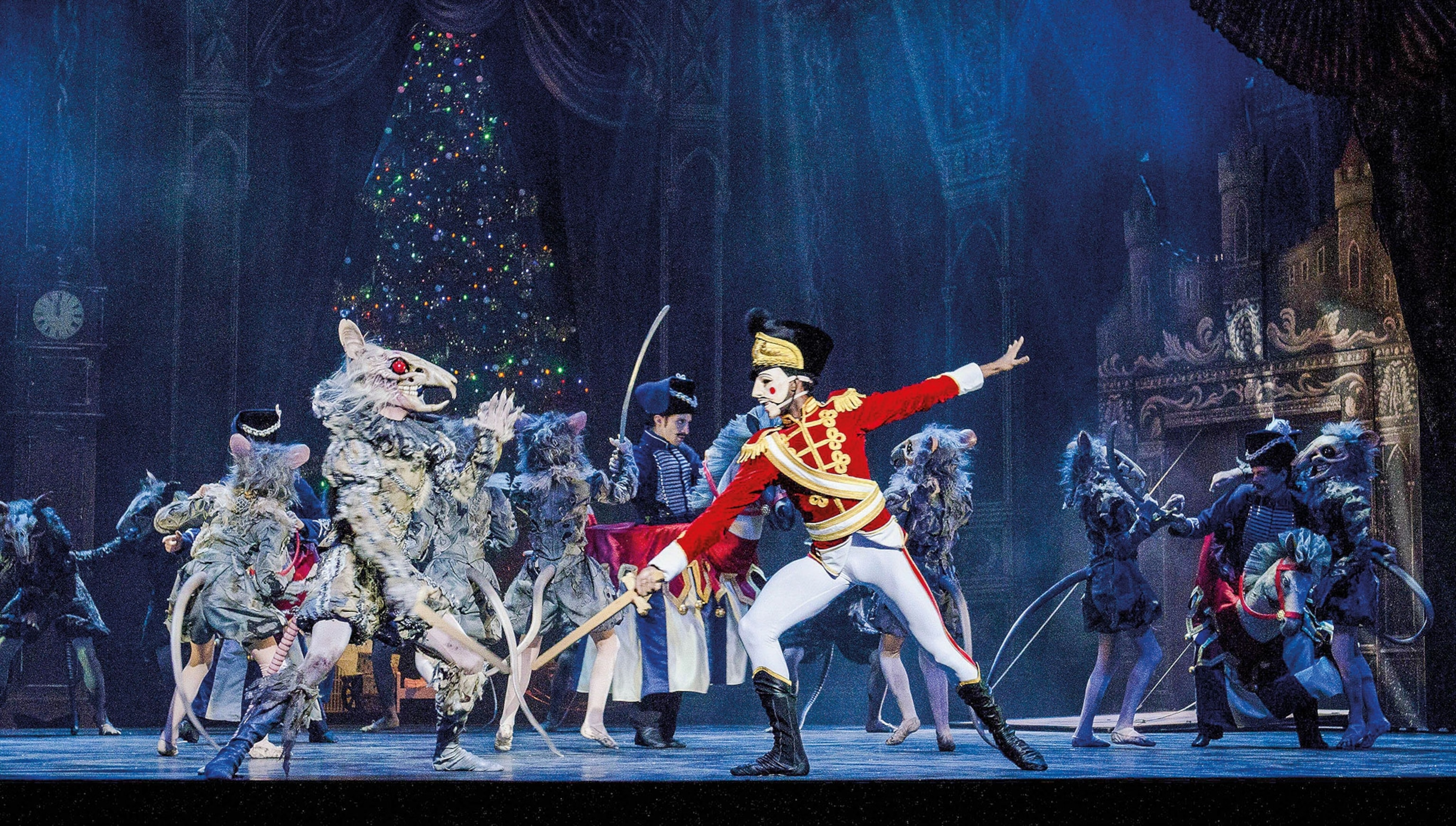 A mouse king spars with a nutcracker in a stage production of the Nutcracker