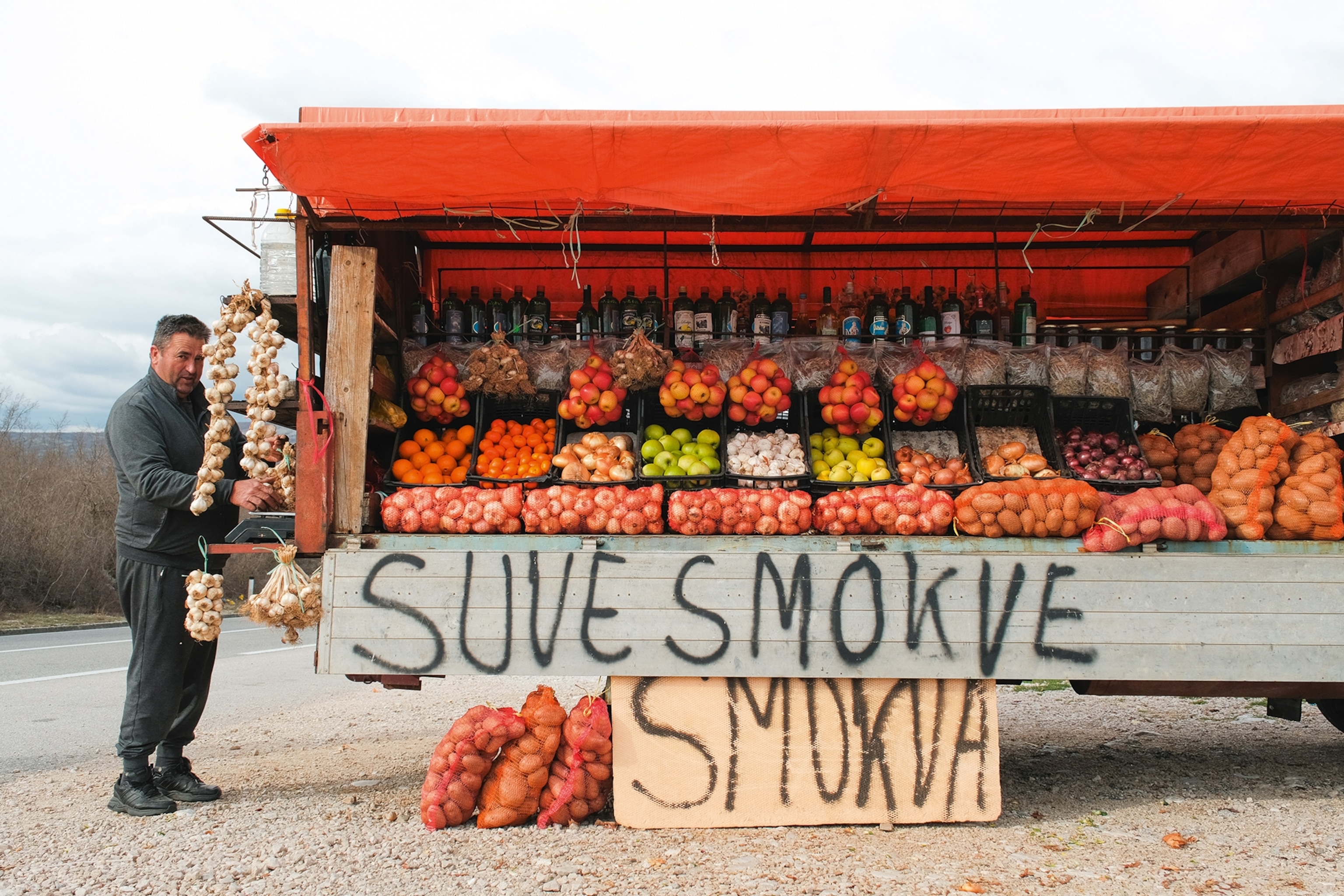 Vendor selling fruit from a market stall